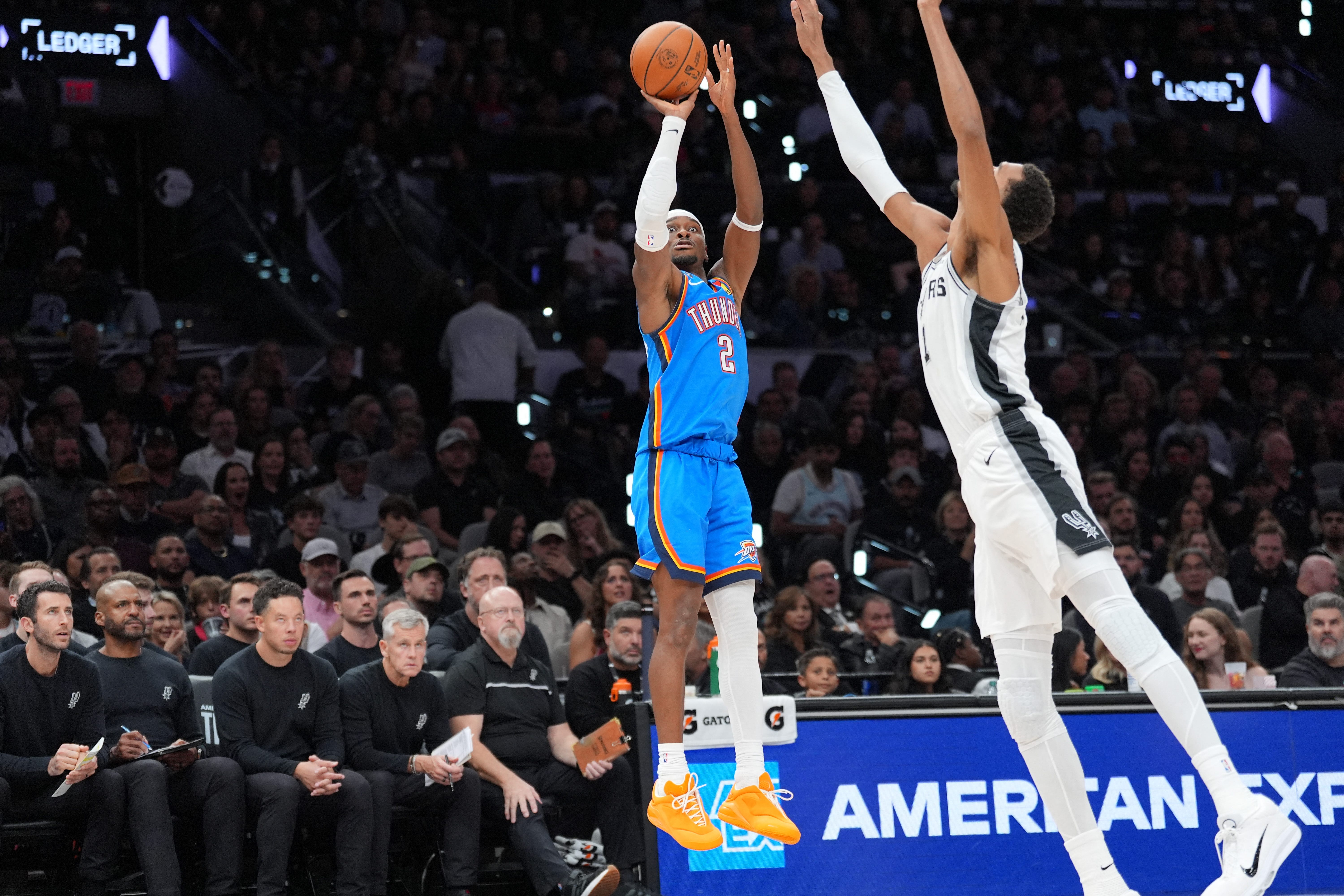 Oct 20, 2026; San Antonio, Texas, USA;  Oklahoma City Thunder guard Shai Gilgeous-Alexander (2) shoots in front of San Antonio Spurs forward Victor Wembanyama (1) in the first half at Frost Bank Center.  Mandatory Credit: Daniel Dunn-Imagn Images