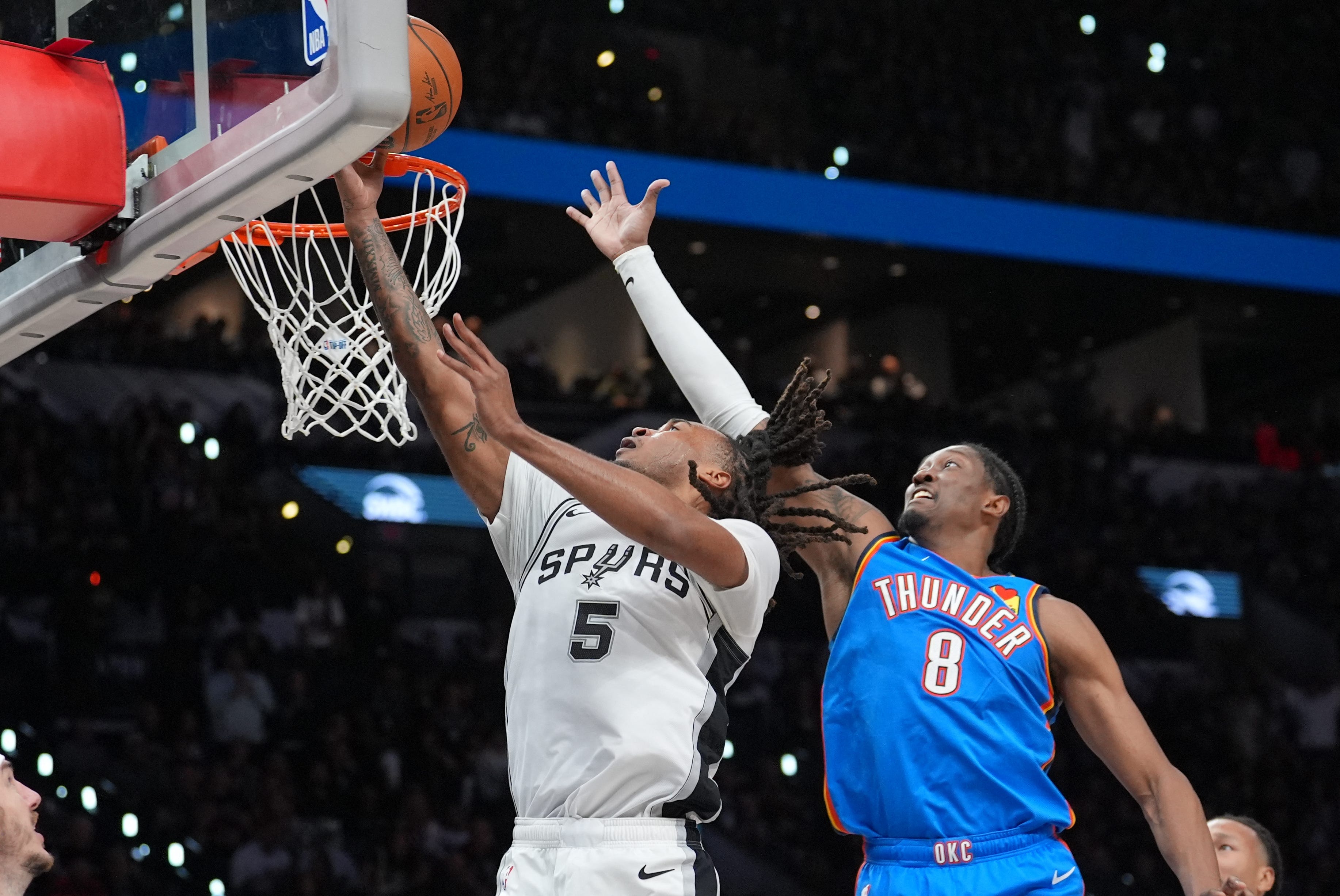 Oct 20, 2026; San Antonio, Texas, USA;  San Antonio Spurs guard Stephon Castle (5) shoots in front of Oklahoma City Thunder guard Jalen Williams (8) in the second half at Frost Bank Center.  Mandatory Credit: Daniel Dunn-Imagn Images