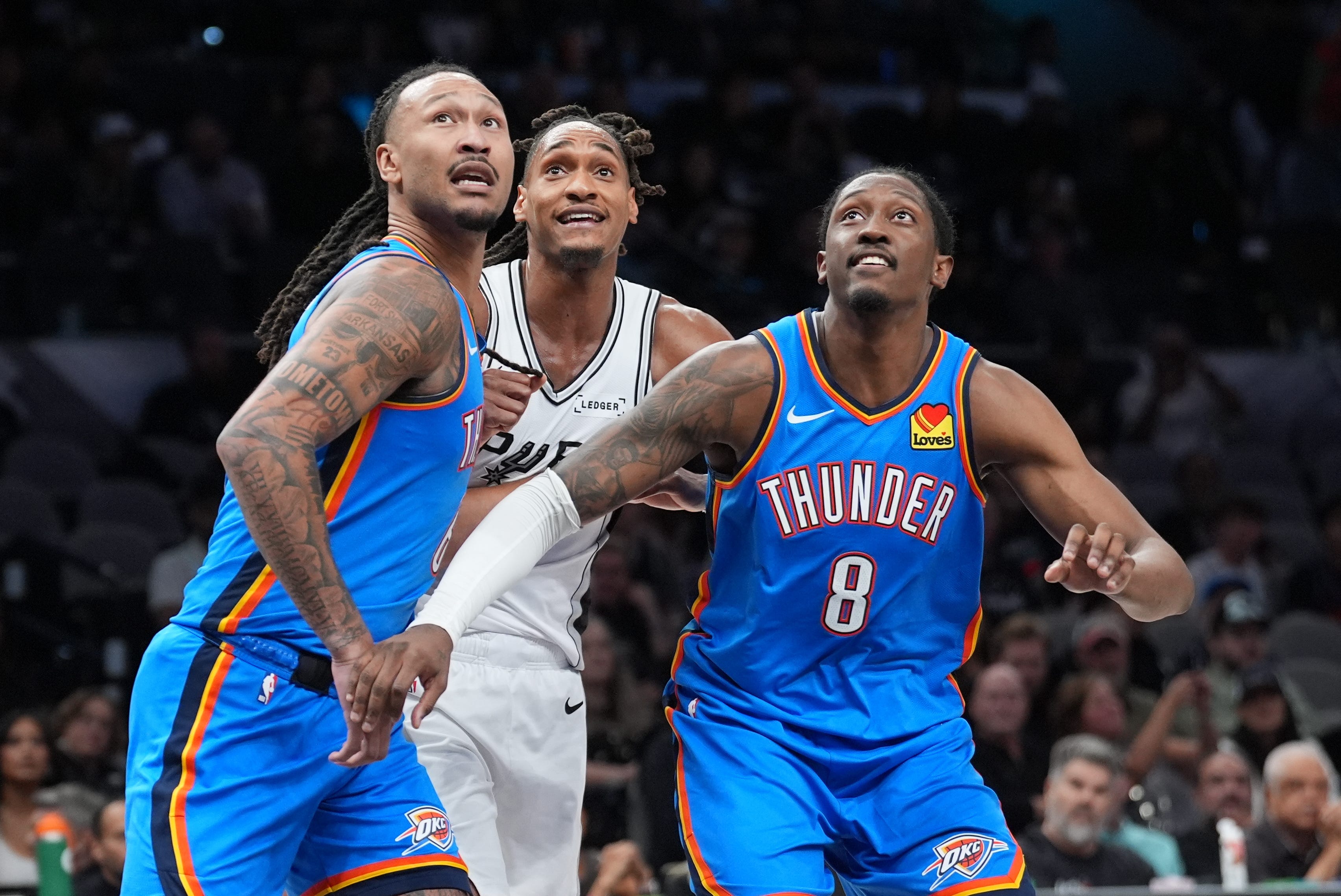 Oct 20, 2026; San Antonio, Texas, USA;  Oklahoma City Thunder forward Jaylin Williams (6) and guard Jalen Williams (8) block out San Antonio Spurs guard Devin Vassell (24) in the second half at Frost Bank Center.  Mandatory Credit: Daniel Dunn-Imagn Images