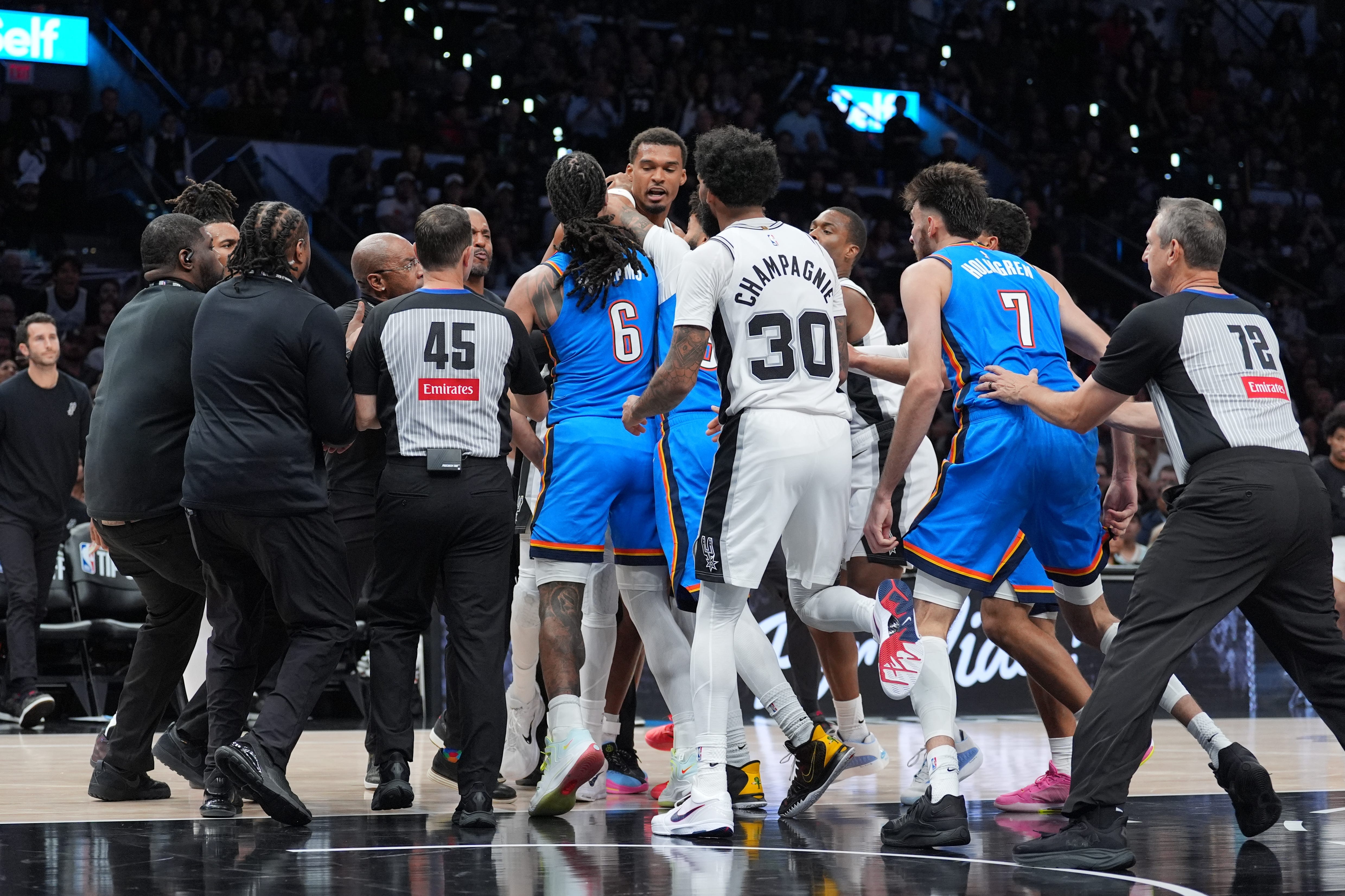 Oct 20, 2026; San Antonio, Texas, USA;  Oklahoma City Thunder forward Jaylin Williams (6) gets in an altercation with San Antonio Spurs forward Victor Wembanyama (1) in the first half at Frost Bank Center.  Mandatory Credit: Daniel Dunn-Imagn Images