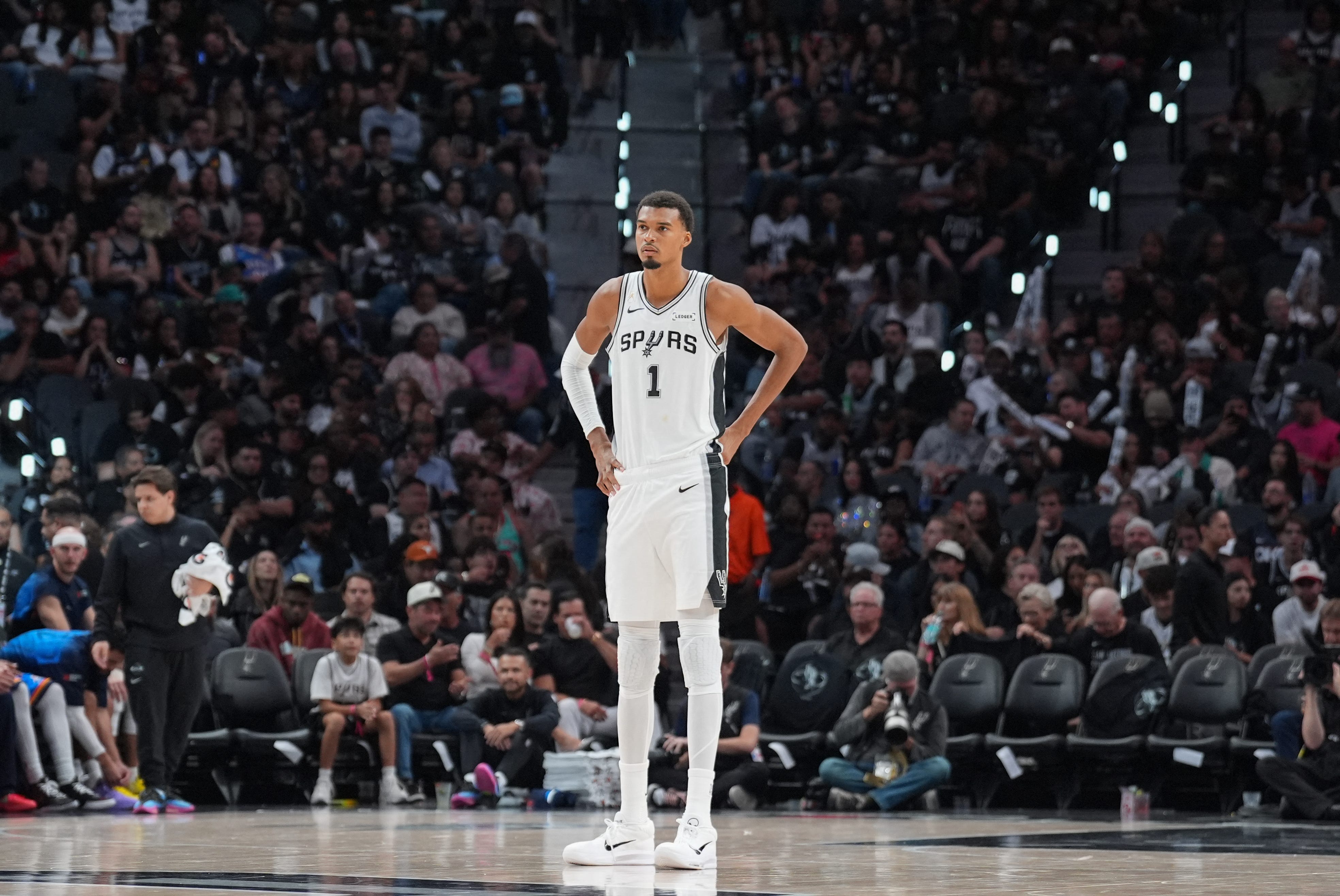 Oct 20, 2026; San Antonio, Texas, USA;  San Antonio Spurs forward Victor Wembanyama (1) looks up the court in the second half against the Oklahoma City Thunder at Frost Bank Center.  Mandatory Credit: Daniel Dunn-Imagn Images