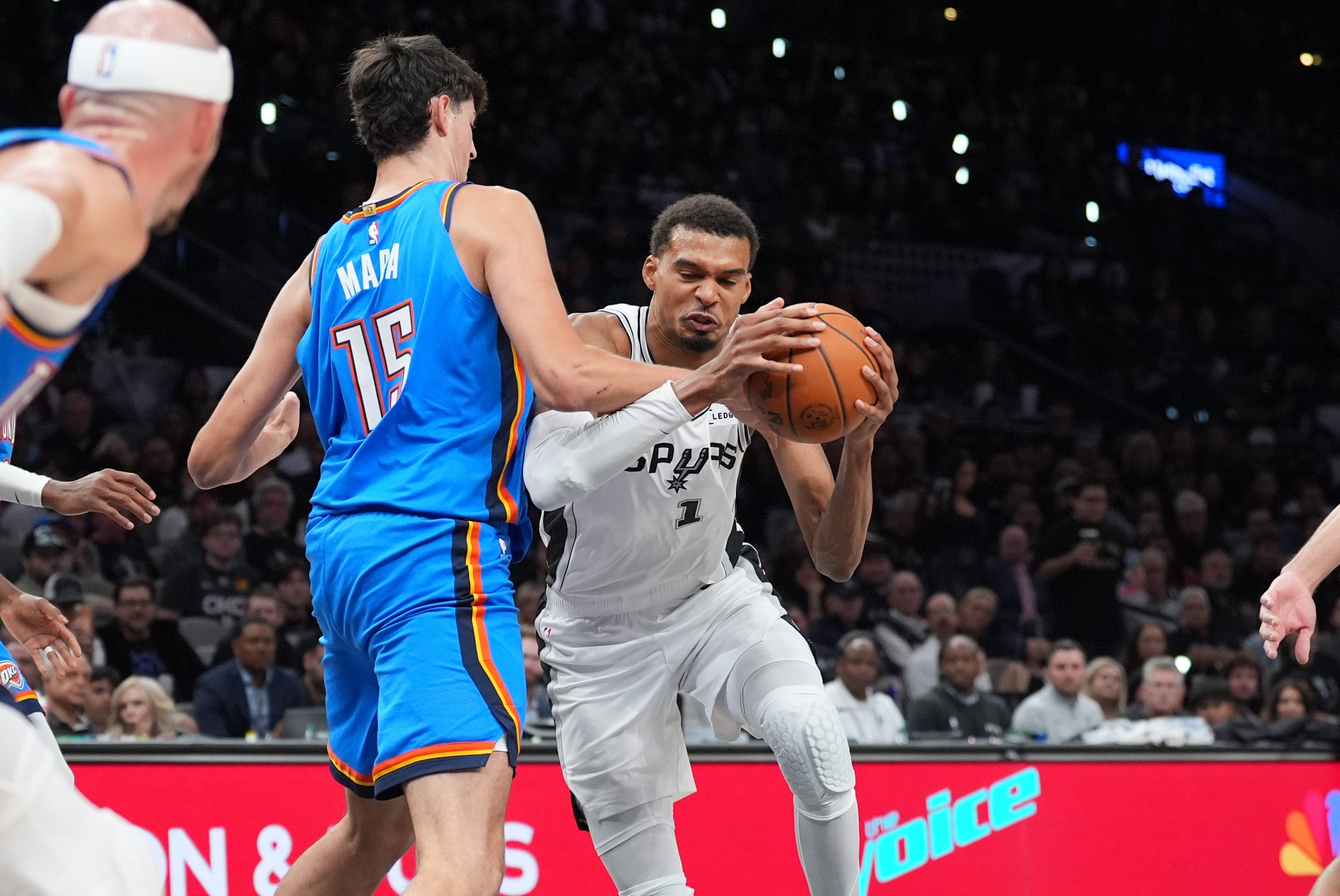 Oct 20, 2026; San Antonio, Texas, USA;  San Antonio Spurs forward Victor Wembanyama (1) dribbles against Oklahoma City Thunder center Aday Mara (15) in the second half at Frost Bank Center.  Mandatory Credit: Daniel Dunn-Imagn Images