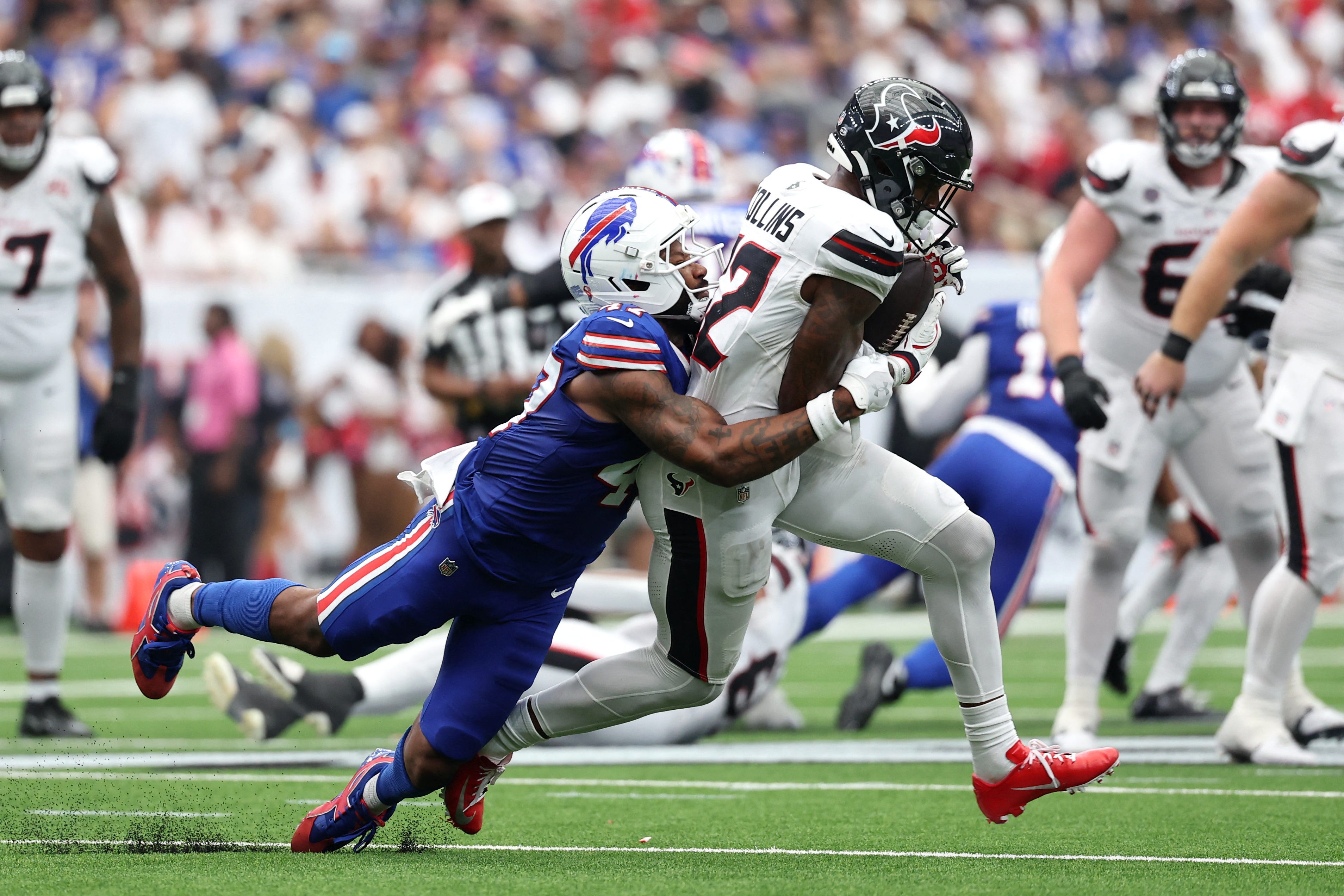 Sep 13, 2026; Houston, Texas, USA;  Houston Texans wide receiver Nico Collins (12) runs with the ball after a catch against Buffalo Bills cornerback Christian Benford (47) during the fourth quarter at Reliant Stadium.  Mandatory Credit: Troy Taormina-Imagn Images