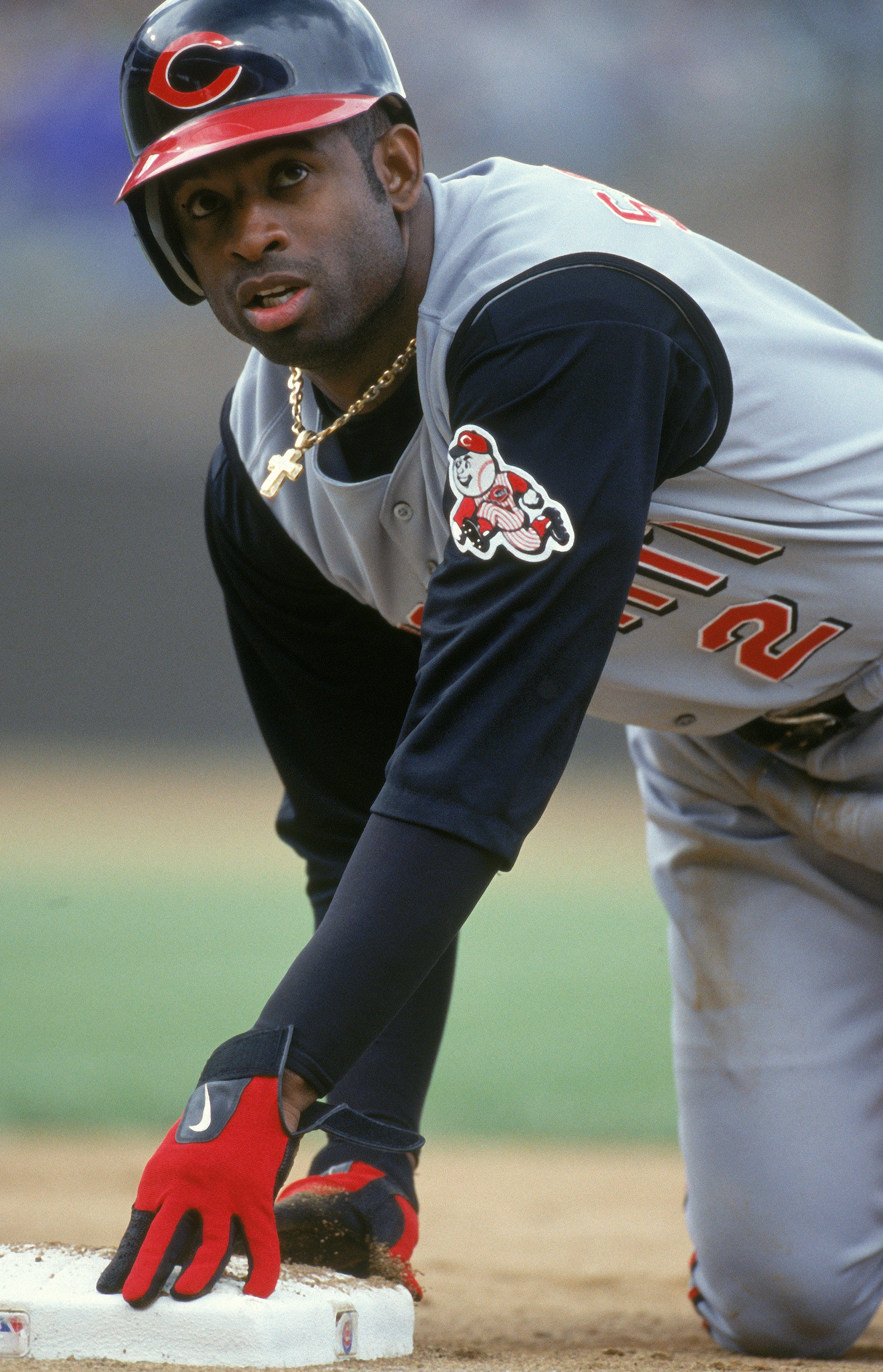 Deion Sanders #3 of the Cincinnati Reds tags the base during the game against the Chicago Cubs at Wrigley Field in Chicago, Illinois. The Cubs defeated the Reds 4-2.