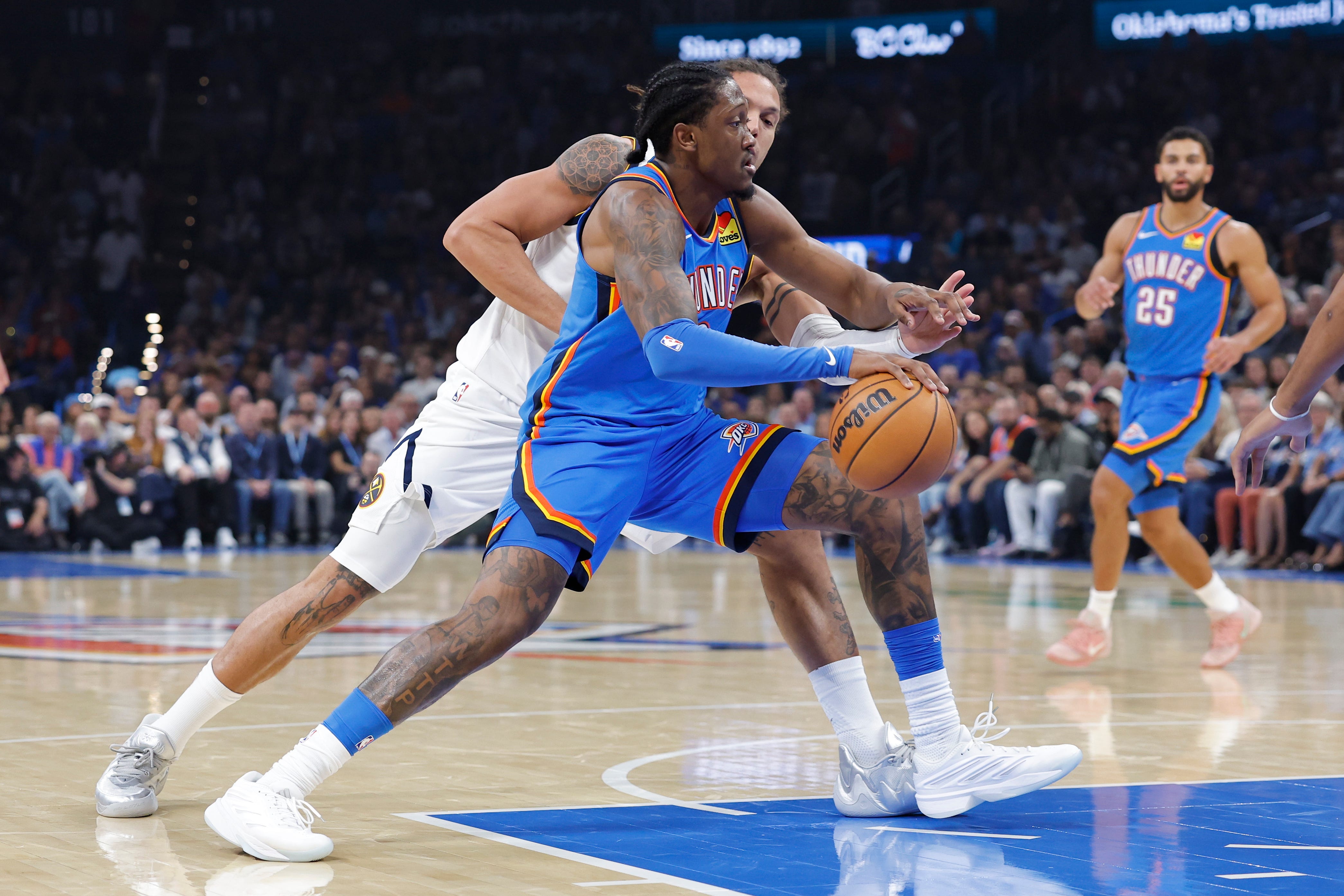 Oct 22, 2026; Oklahoma City, Oklahoma, USA; Oklahoma City Thunder guard Jalen Williams (8) drives past Denver Nuggets forward Aaron Gordon (32) during the first half at Paycom Center. Mandatory Credit: Alonzo Adams-Imagn Images