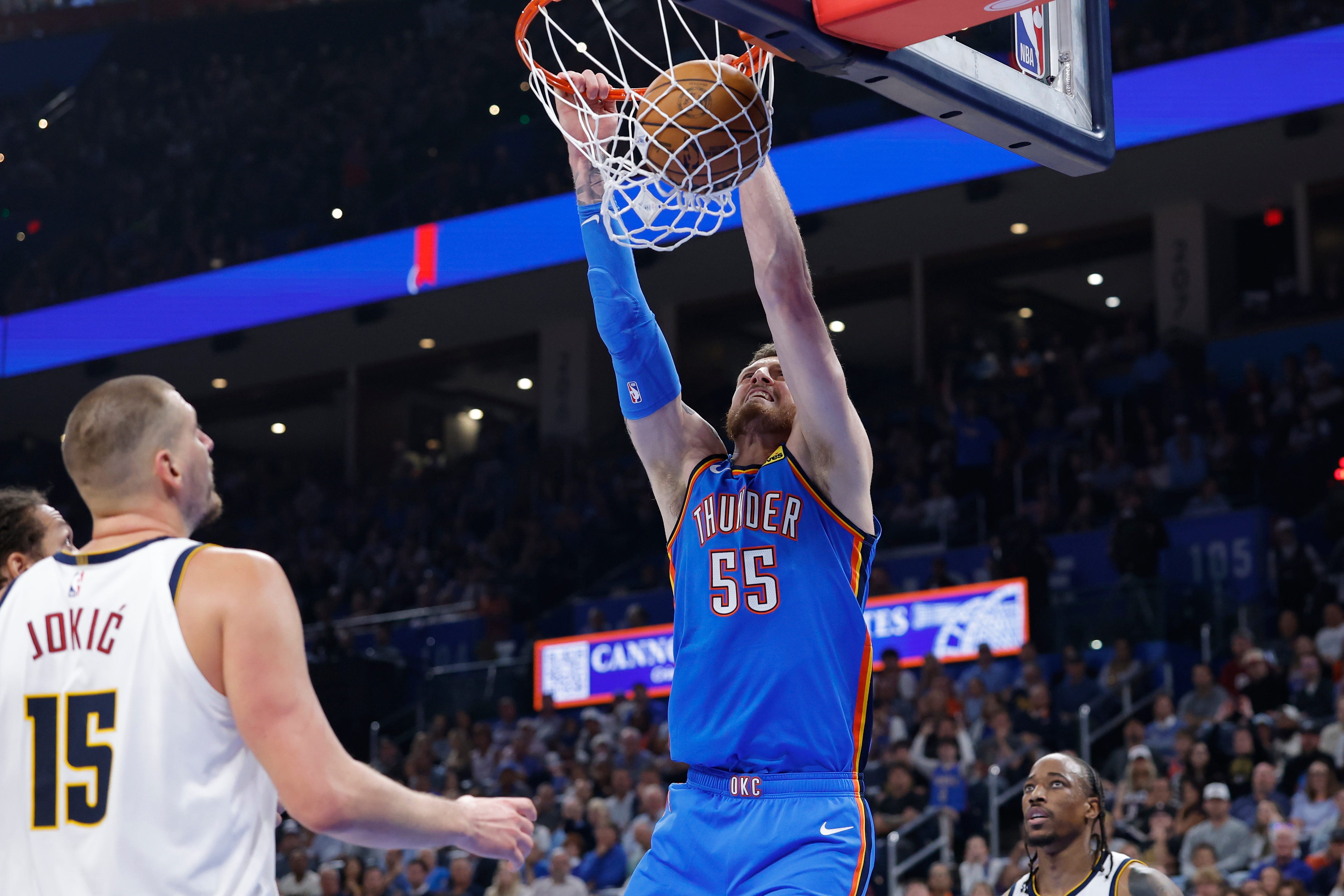 Oct 22, 2026; Oklahoma City, Oklahoma, USA; Oklahoma City Thunder center Isaiah Hartenstein (55) dunks against the Denver Nuggets during the first half at Paycom Center. Mandatory Credit: Alonzo Adams-Imagn Images
