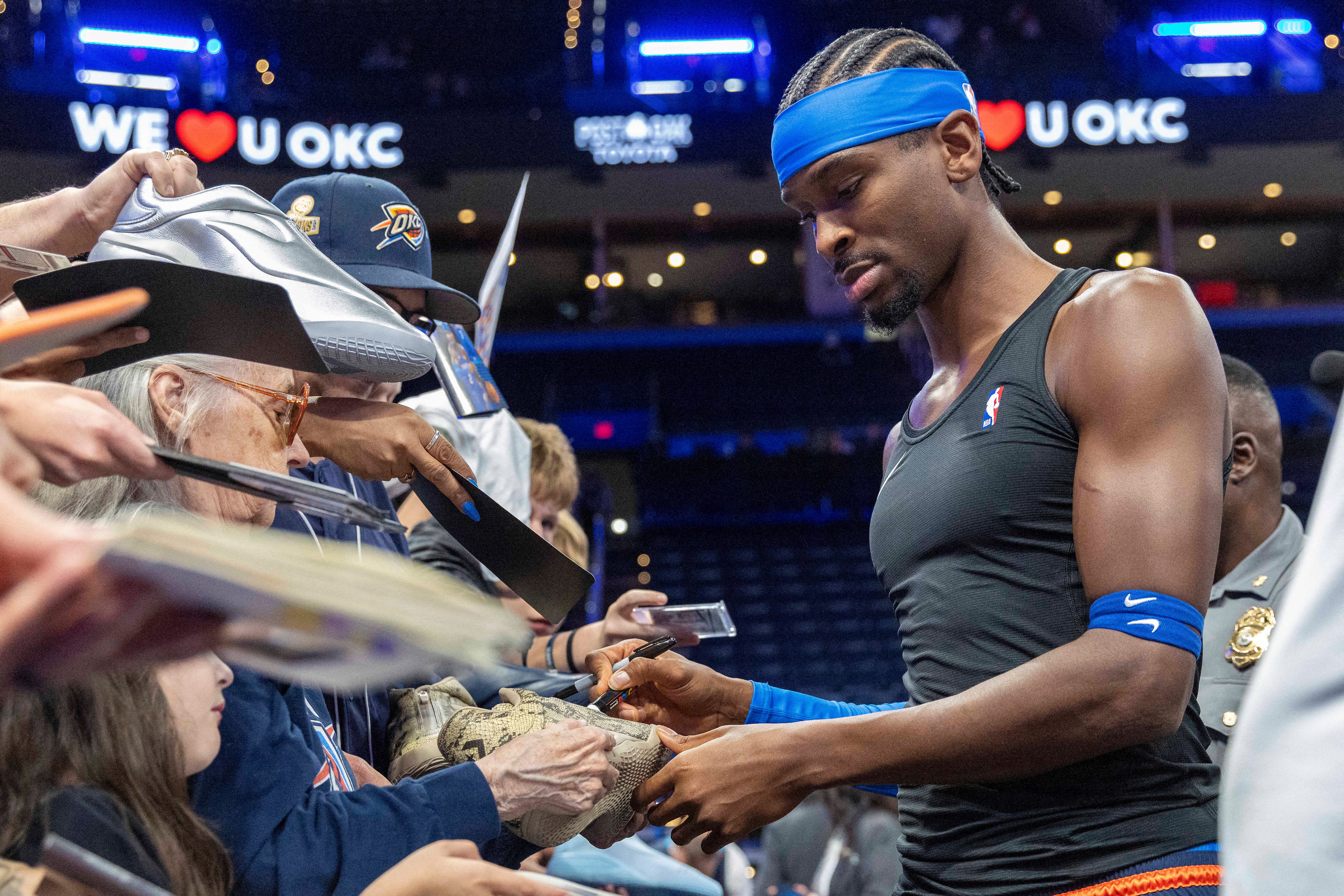Oct 22, 2026; Oklahoma City, Oklahoma, USA; Oklahoma City Thunder guard Shai Gilgeous-Alexander (2) signs his autograph for fans before a game against the Denver Nuggets at Paycom Center. Mandatory Credit: Alonzo Adams-Imagn Images