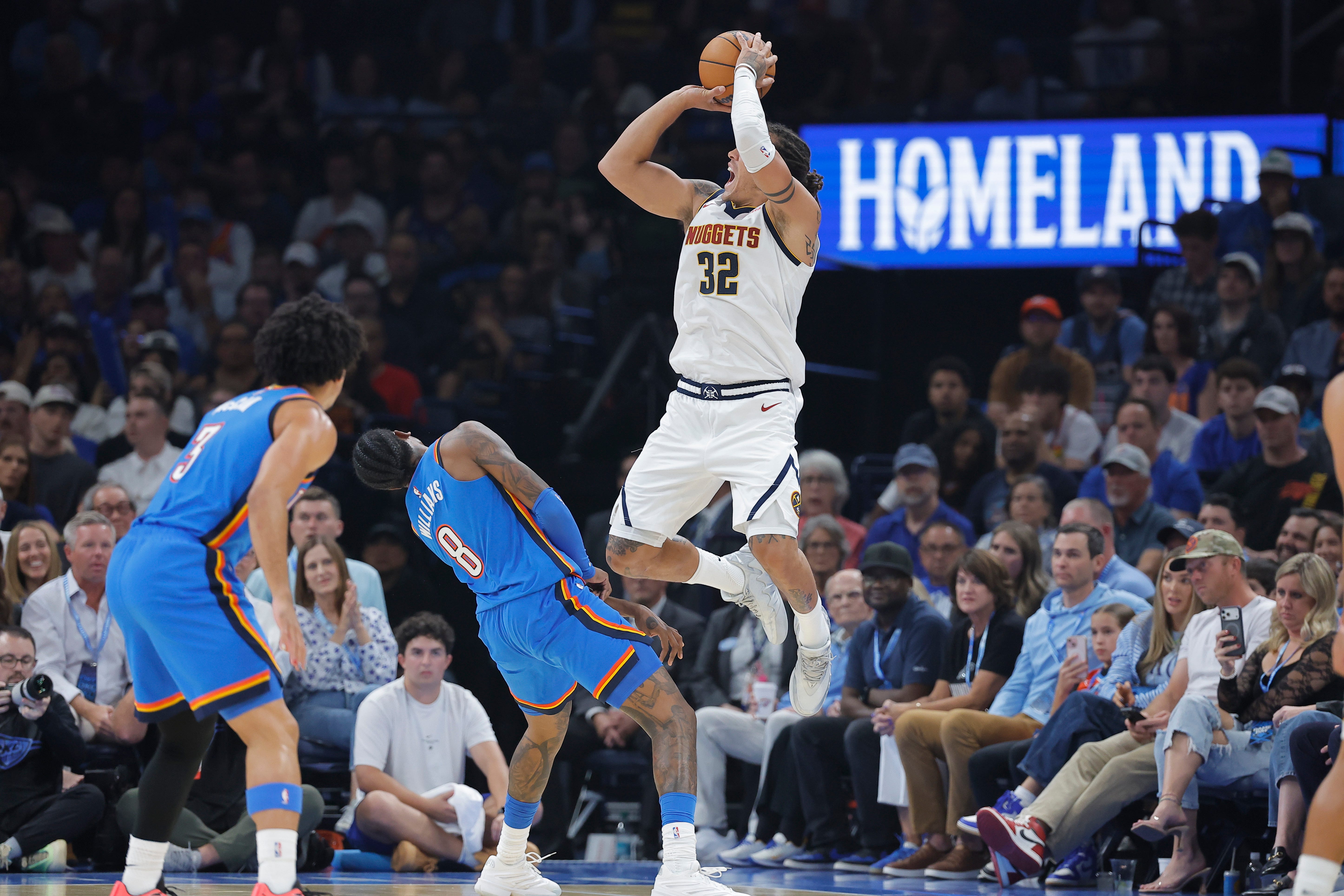 Oct 22, 2026; Oklahoma City, Oklahoma, USA; Denver Nuggets forward Aaron Gordon (32) fouls Oklahoma City Thunder guard Jalen Williams (8) as he shoots during the first half at Paycom Center. Mandatory Credit: Alonzo Adams-Imagn Images