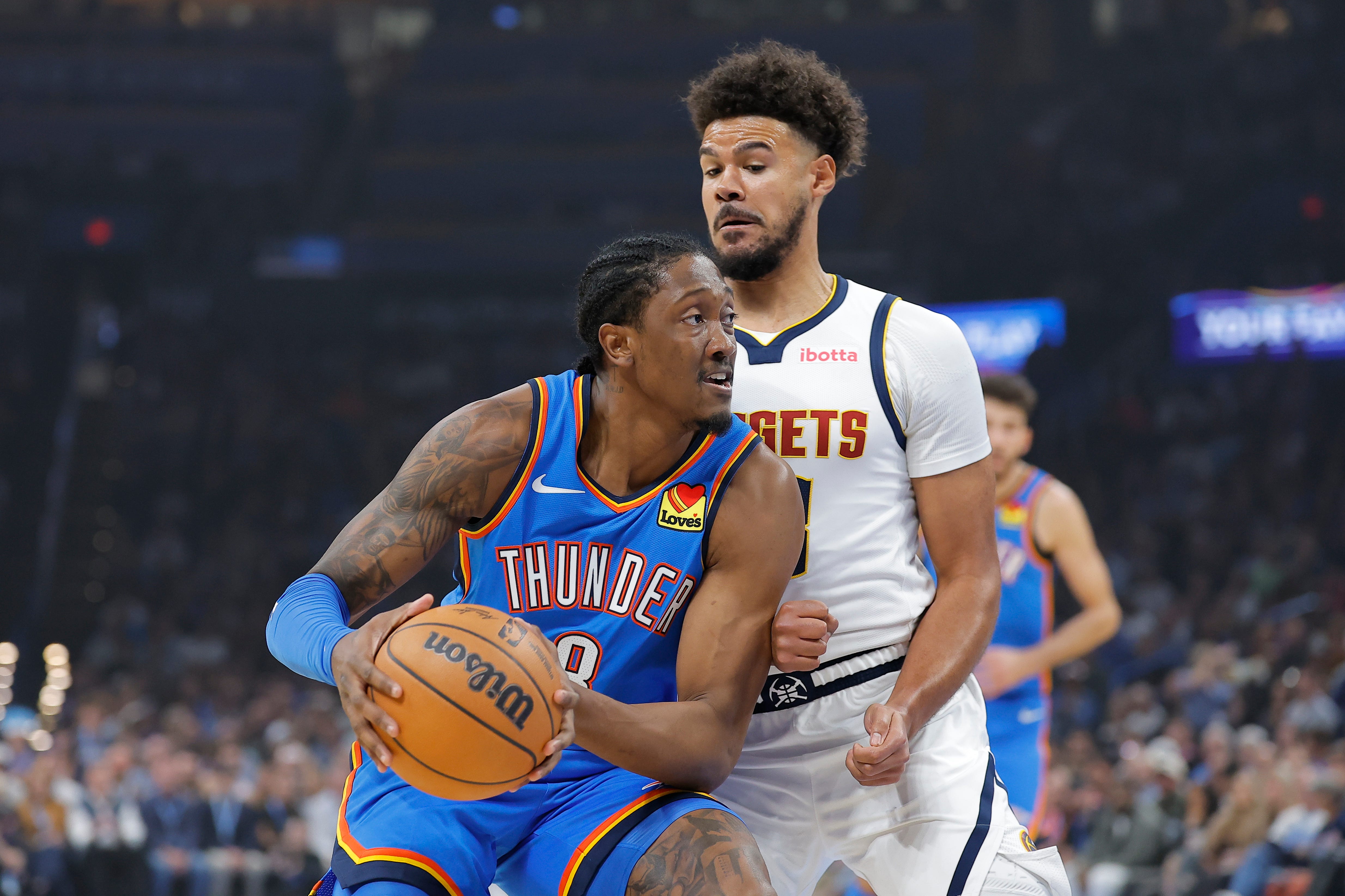 Oct 22, 2026; Oklahoma City, Oklahoma, USA; Oklahoma City Thunder guard Jalen Williams (8) drives around Denver Nuggets forward Cameron Johnson (23) during the first quarter at Paycom Center. Mandatory Credit: Alonzo Adams-Imagn Images