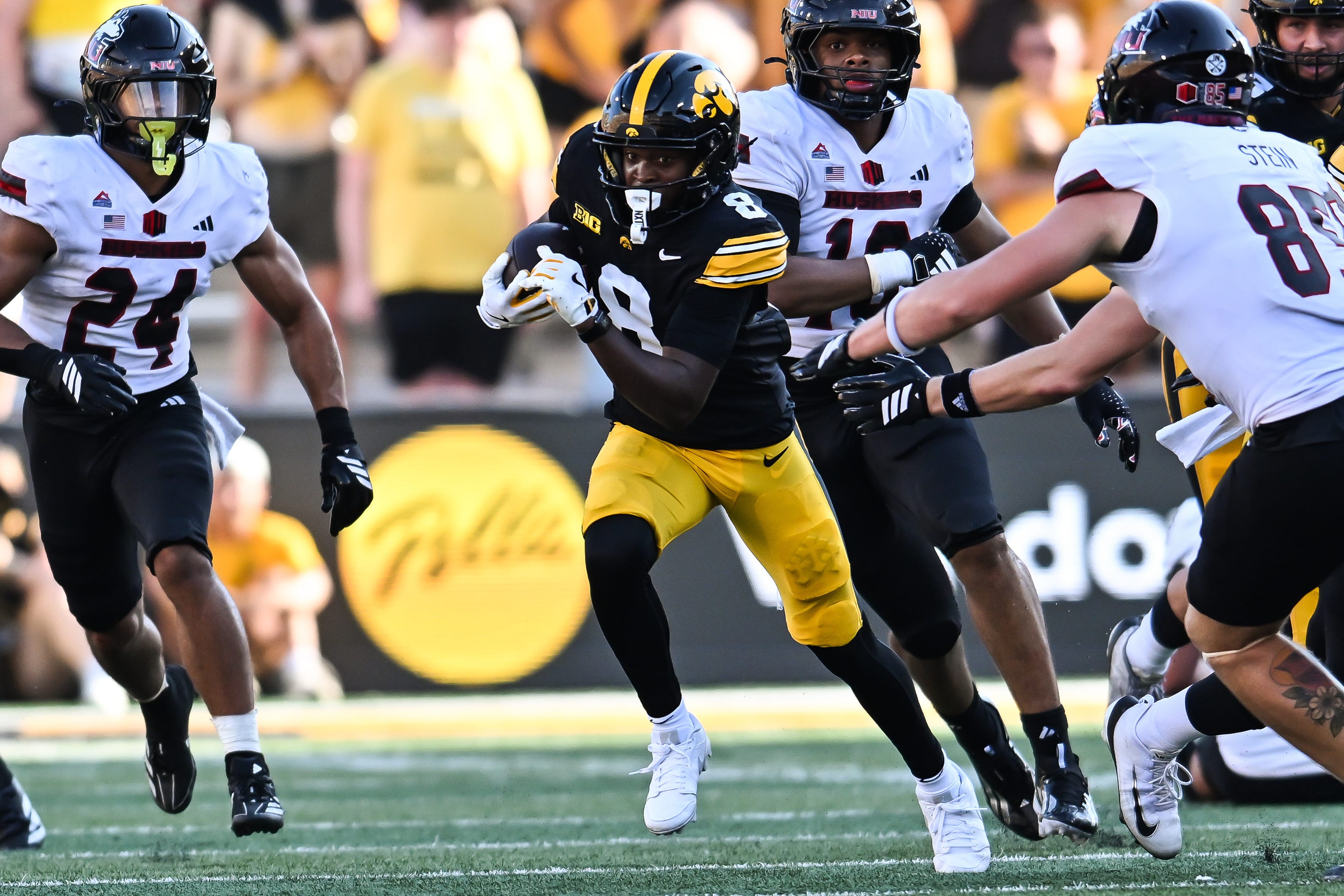 Sep 5, 2026; Iowa City, Iowa, USA;  Iowa Hawkeyes wide receiver Evan James (8) runs the ball as Northern Illinois Huskies running back Elijah Porter (24) looks to pursue during the third quarter at Kinnick Stadium.  Mandatory Credit: Jeffrey Becker-Imagn Images