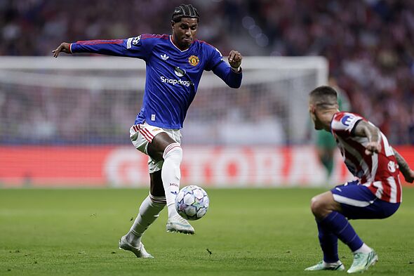 Marcus Rashford running with the ball.
