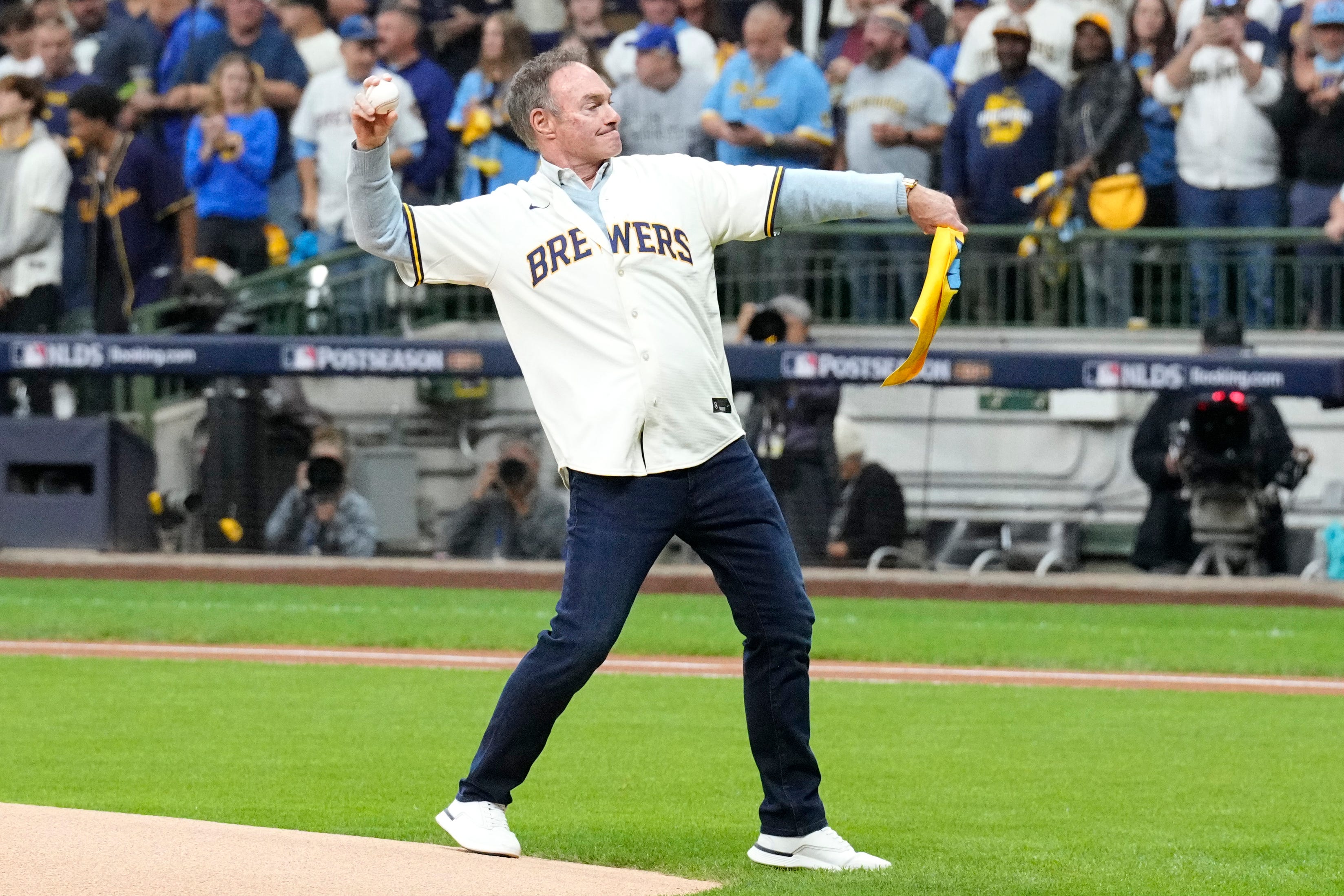 Who is singing World Series Game 2 anthem and throwing first pitch in Milwaukee?