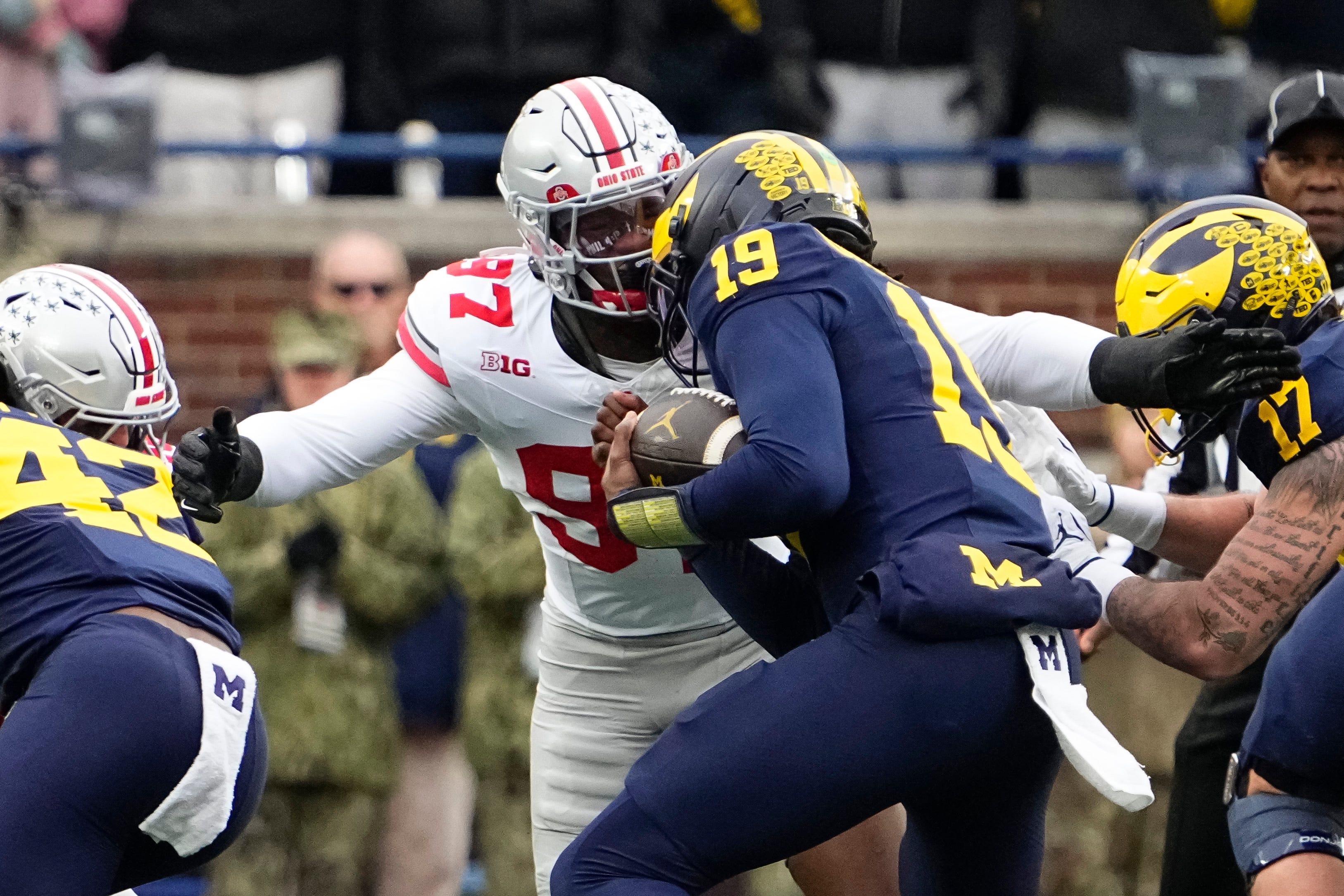 Ohio State Buckeyes defensive end Kenyatta Jackson Jr. (97) tackles Michigan Wolverines quarterback Bryce Underwood (19) during the NCAA football game at Michigan Stadium in Ann Arbor, Mich. on Nov. 29, 2025.