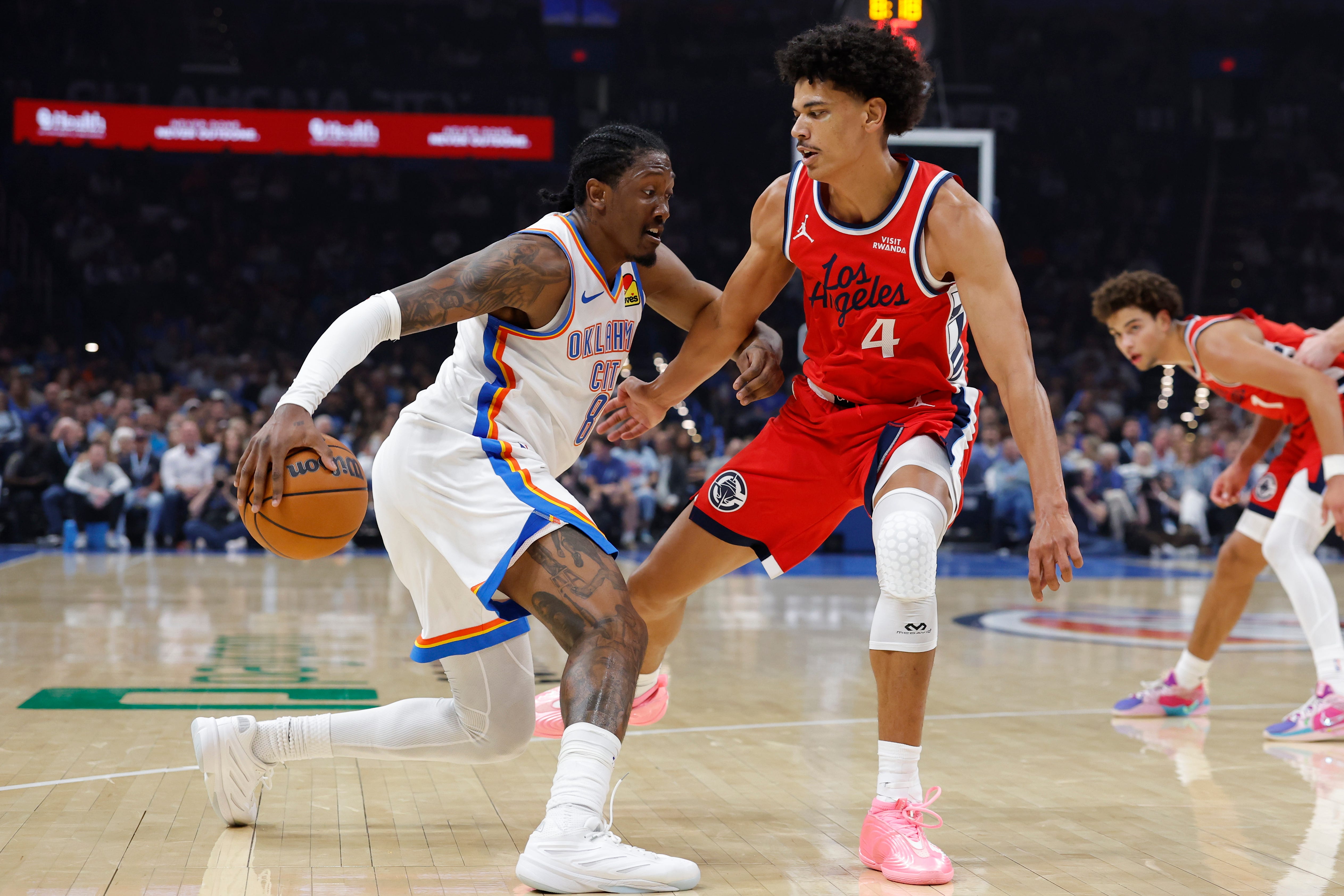 Oct 25, 2026; Oklahoma City, Oklahoma, USA; Oklahoma City Thunder guard Jalen Williams (8) drives to the basket against Los Angeles Clippers guard Kobe Sanders (4) during the first half at Paycom Center. Mandatory Credit: Alonzo Adams-Imagn Images