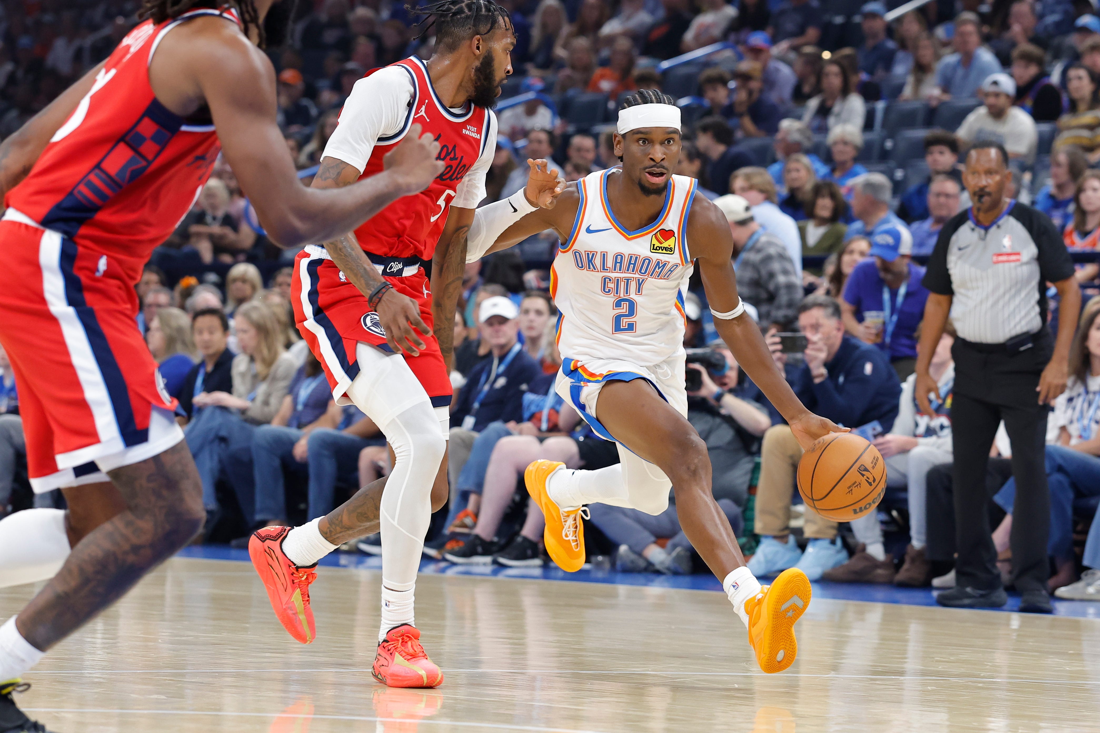 Oct 25, 2026; Oklahoma City, Oklahoma, USA; Oklahoma City Thunder guard Shai Gilgeous-Alexander (2) drives down the court against the Los Angeles Clippers during the first half at Paycom Center. Mandatory Credit: Alonzo Adams-Imagn Images