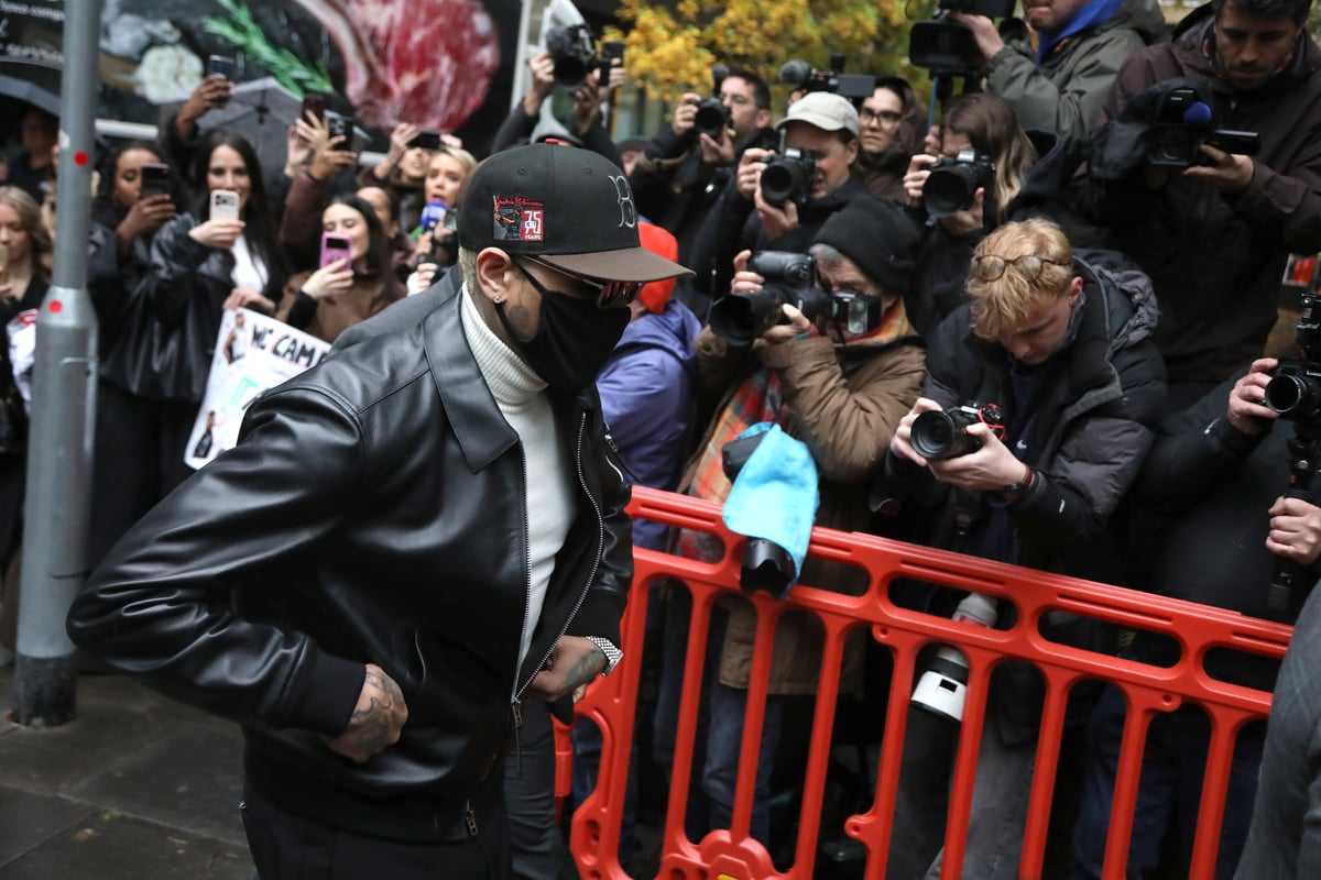In pictures: R&B singer Chris Brown arrives at court in mask for London nightclub attack sentence