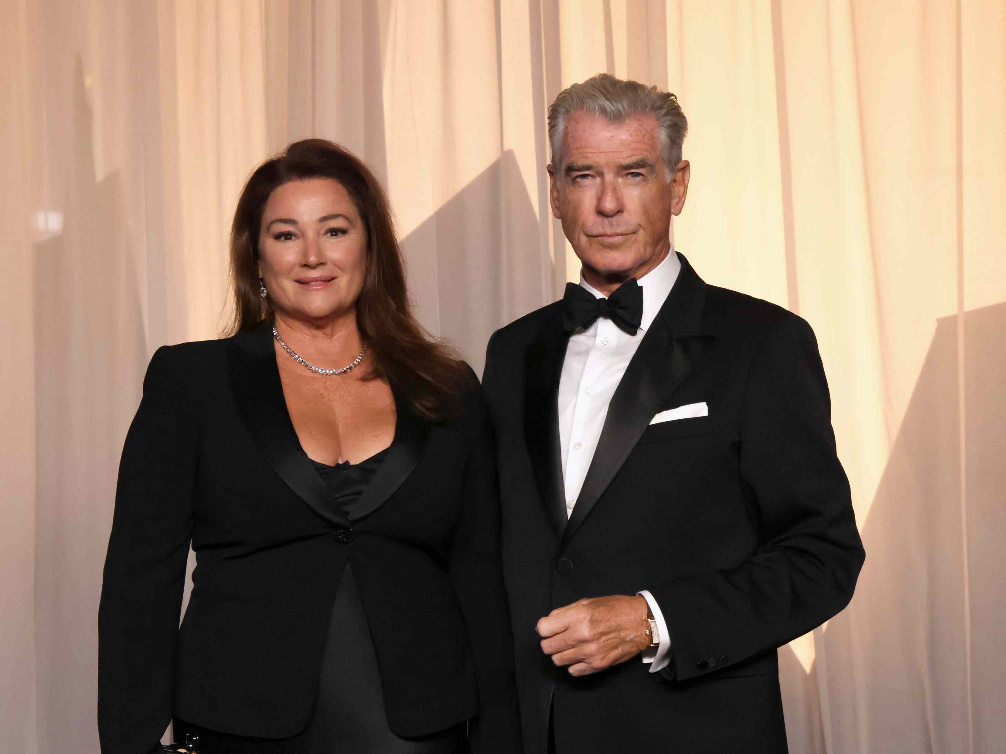 Pierce Brosnan’s Wife Keely Shaye Smith Wears Plunging Plum Slip Dress as She Poses With Husband and Kids