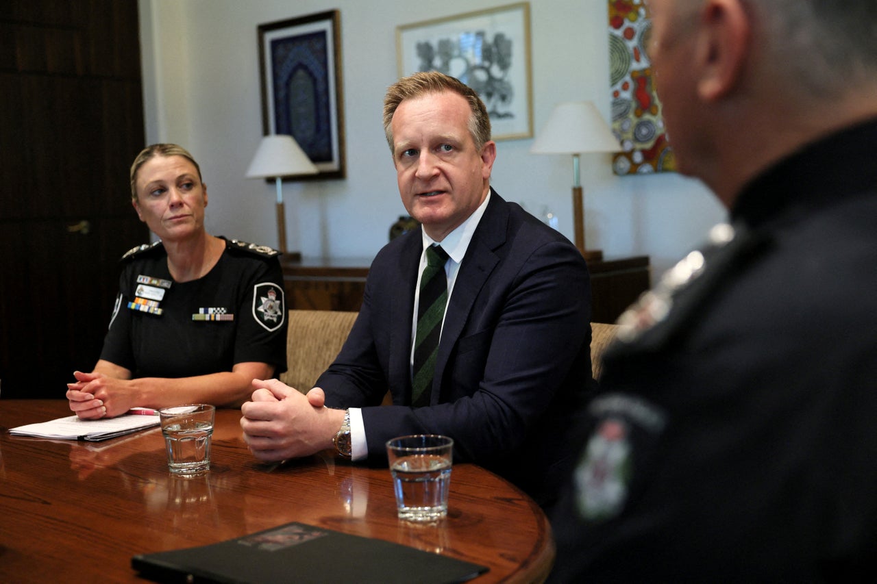 Australian minister says he is being followed after bullet etched with ‘RAT' left on car