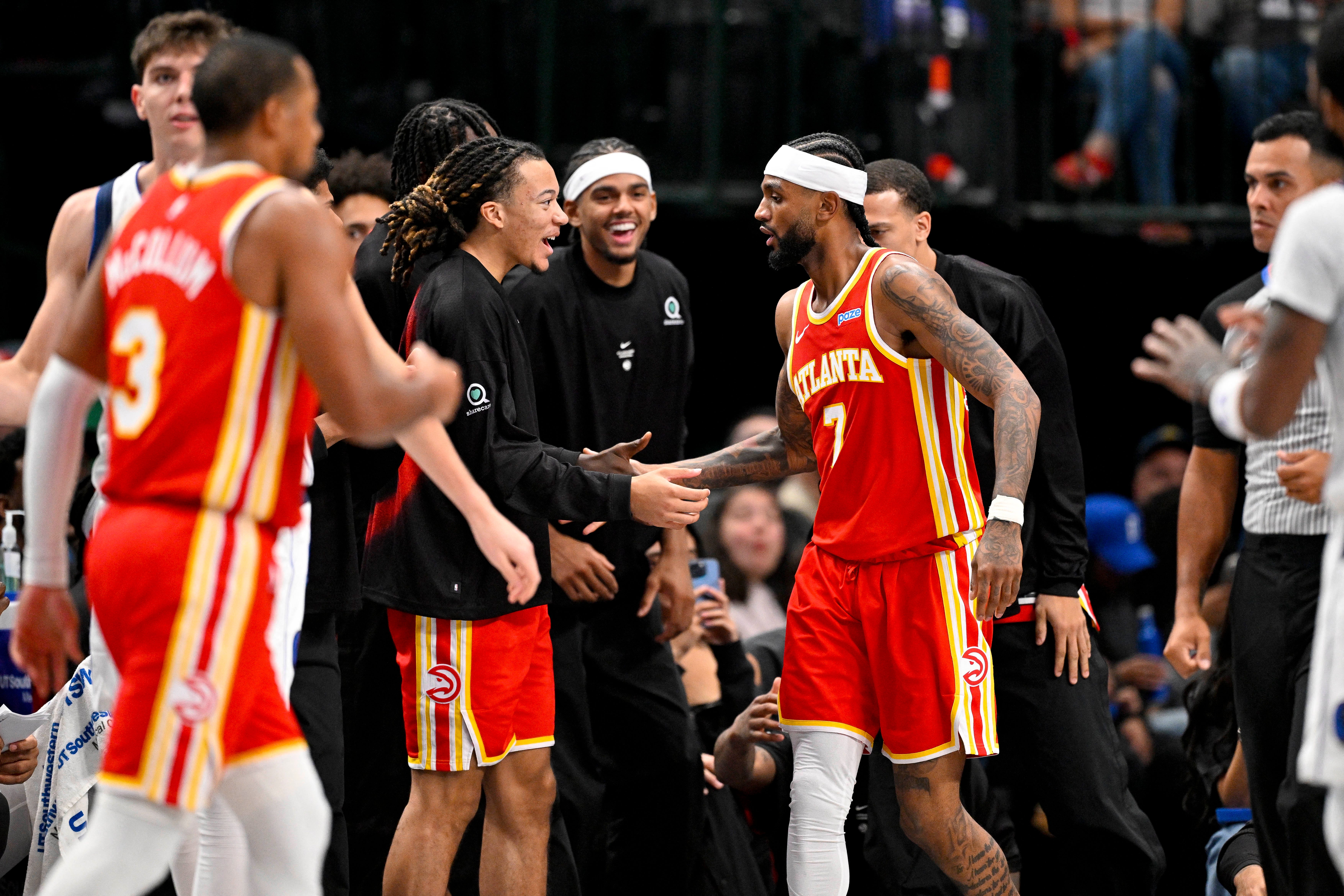 Oct 16, 2026; Dallas, Texas, USA; Atlanta Hawks guard Nickeil Alexander-Walker (7) celebrates with his teammates during the second quarter against the Dallas Mavericks at American Airlines Center. Mandatory Credit: Jerome Miron-Imagn Images
