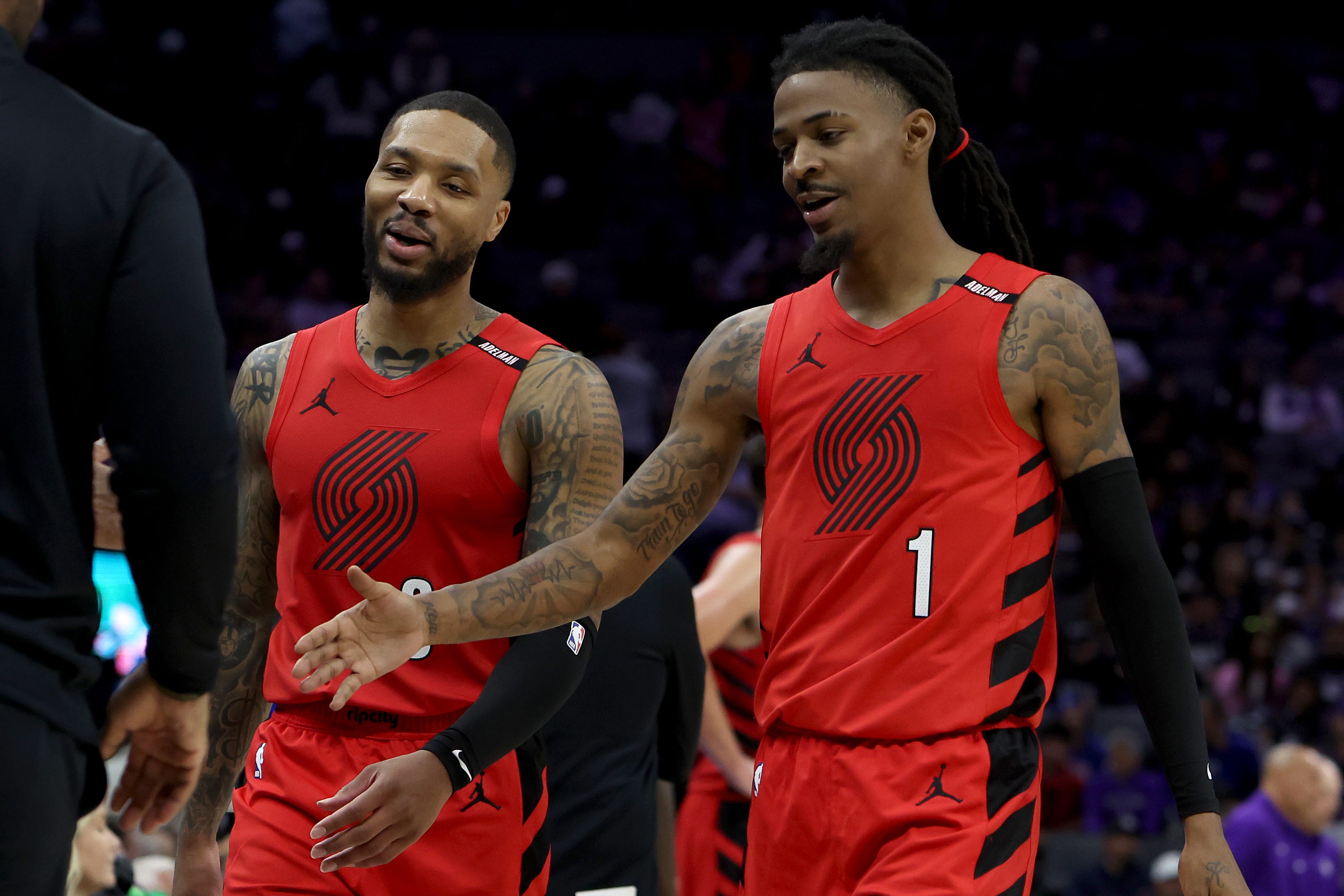 Oct 23, 2026; Sacramento, California, USA;  Portland Trail Blazers guard Damian Lillard (0) and Ja Morant (1) walk towards the bench in a game against the Sacramento Kings during the fourth quarter at Golden 1 Center.  Mandatory Credit: Dennis Lee-Imagn Images