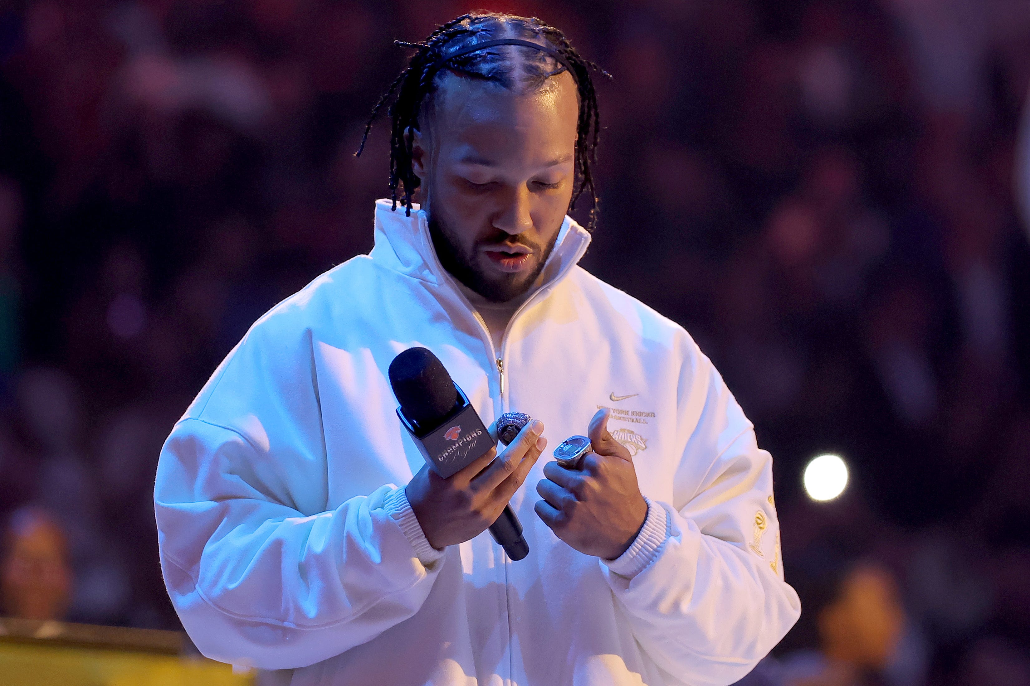 Oct 20, 2026; New York, New York, USA; New York Knicks guard Jalen Brunson (11) inspects his 2025-26 championship ring during a ceremony before an opening night game against the Philadelphia 76ers at Madison Square Garden. Mandatory Credit: Brad Penner-Imagn Images