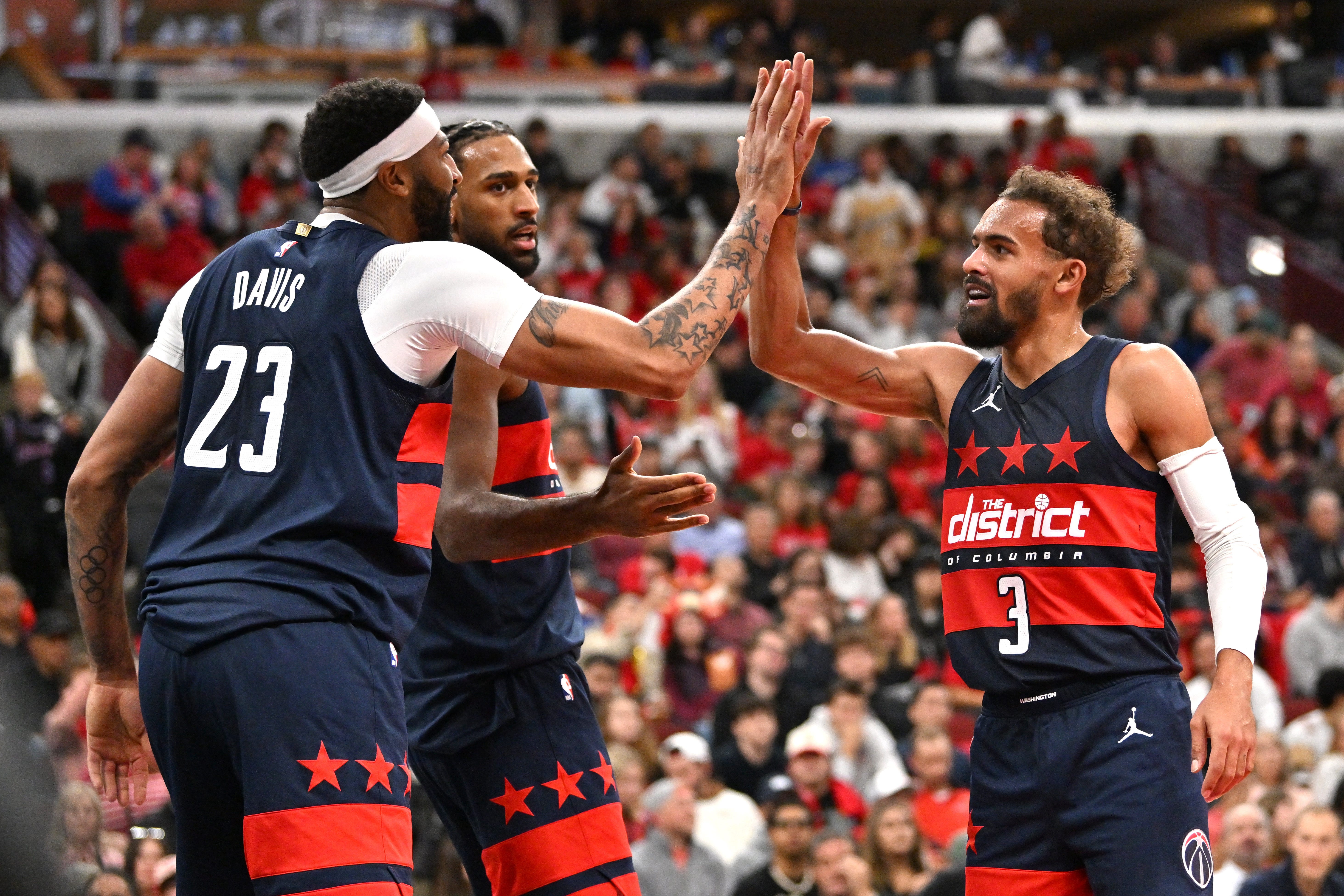 Oct 24, 2026; Chicago, Illinois, USA;  Washington Wizards forward Anthony Davis (23) and guard Trae Young (3) celebrate during the second half against the Chicago Bulls at United Center.  Mandatory Credit: Patrick Gorski-Imagn Images