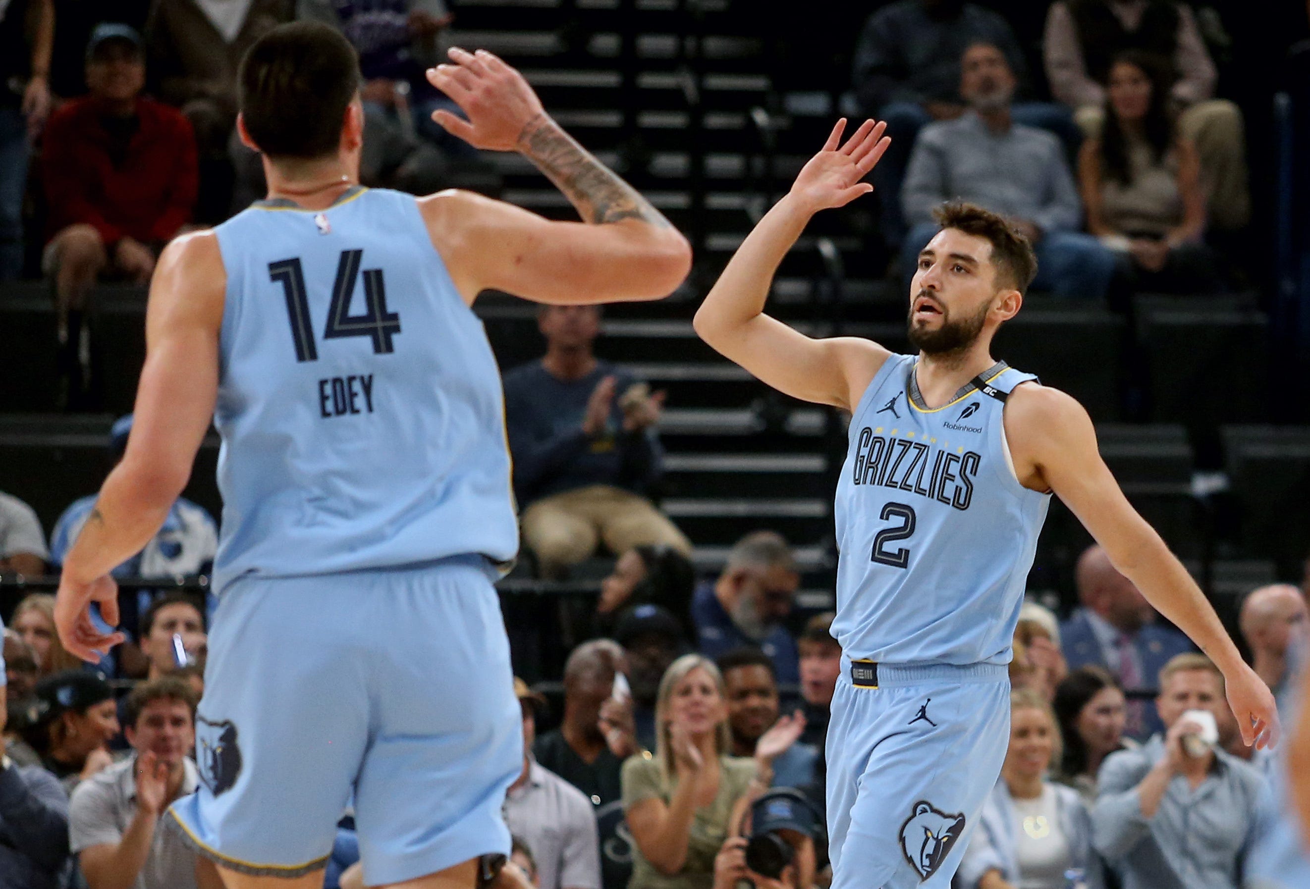 Oct 21, 2026; Memphis, Tennessee, USA;  Memphis Grizzlies guard Ty Jerome (2) reacts with center Zach Edey (14) during the first quarter against the Utah Jazz at FedExForum.  Mandatory Credit: Petre Thomas-Imagn Images
