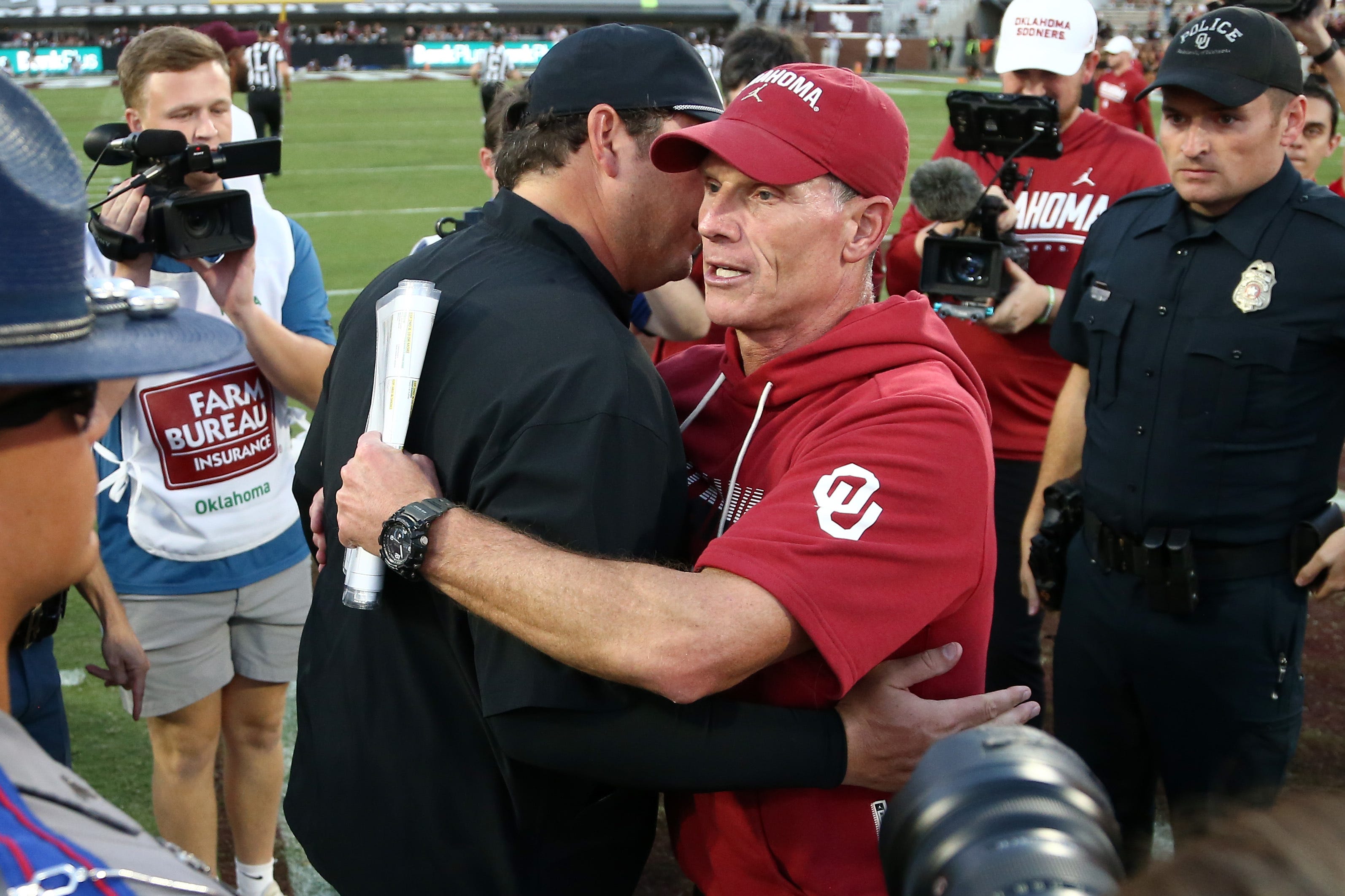 Oct 24, 2026; Starkville, Mississippi, USA;  Mississippi State Bulldogs head coach Jeff Lebby and Oklahoma Sooners head coach Brent Venables embrace after the game at Davis Wade Stadium at Scott Field.  Mandatory Credit: Petre Thomas-Imagn Images