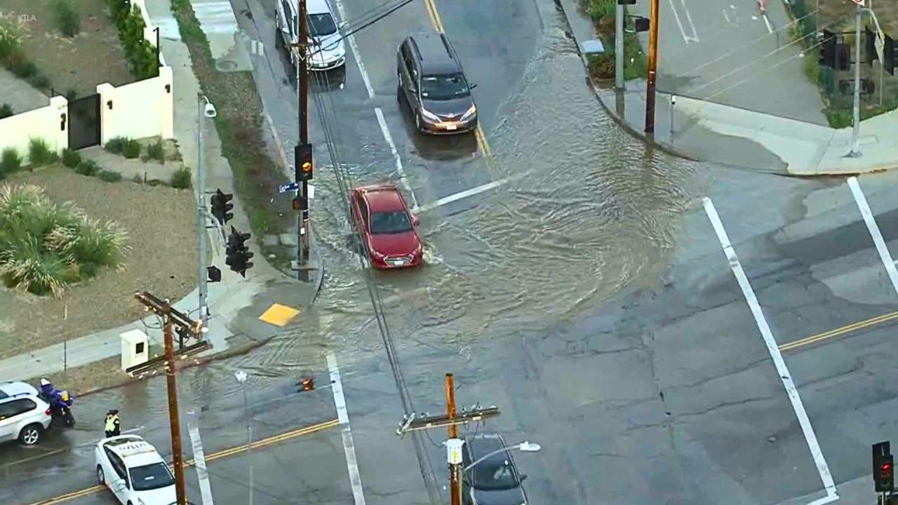 Flooding, outages in Woodland Hills after water main ruptures - AOL