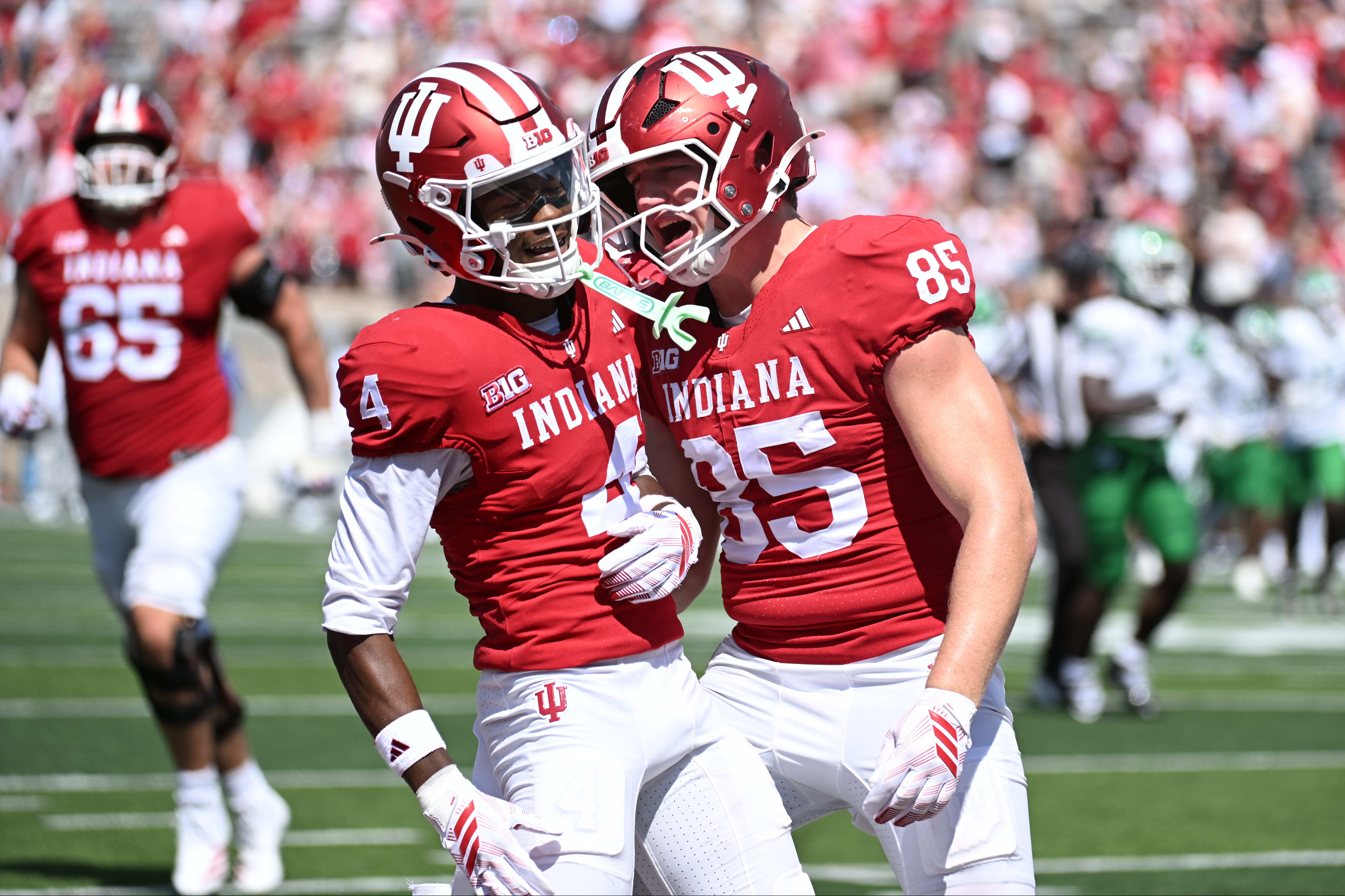 Sep 5, 2026; Bloomington, Indiana, USA;  Indiana Hoosiers wide receiver Davion Chandler (4) celebrates  with tight end Andrew Barker (85) after scoring a touchdown against the North Texas Mean Green during the fourth quarter at Merchants Bank Field at Memorial Stadium.  Mandatory Credit: Robert Goddin-Imagn Images