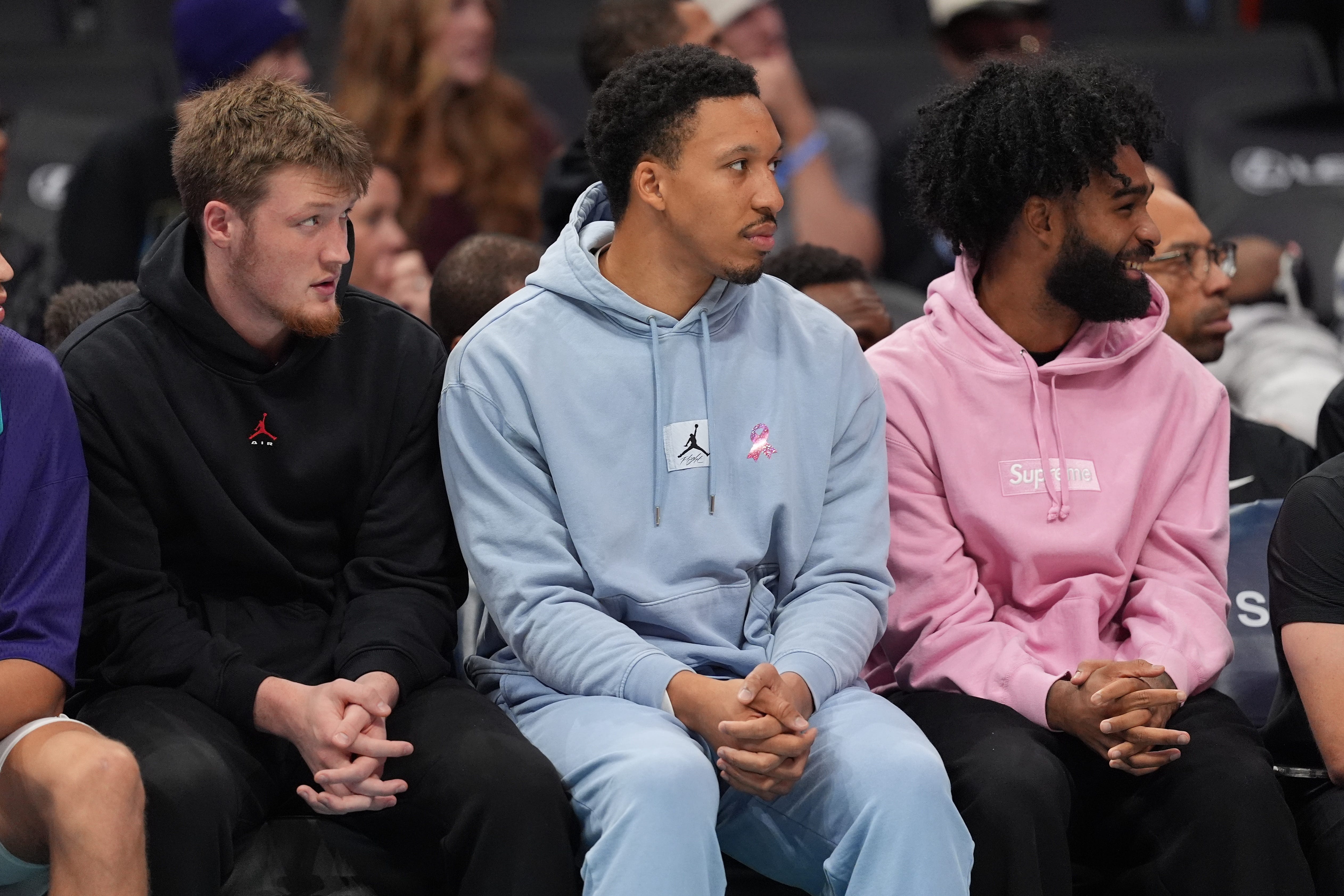 Oct 26, 2026; Charlotte, North Carolina, USA;  Charlotte Hornets guard Kon Knueppel (7), forward Grant Williams (2) and guard Coby White (3) on the bench during the first half against the Washington Wizards at the Spectrum Center.  Mandatory Credit: Jim Dedmon-Imagn Images