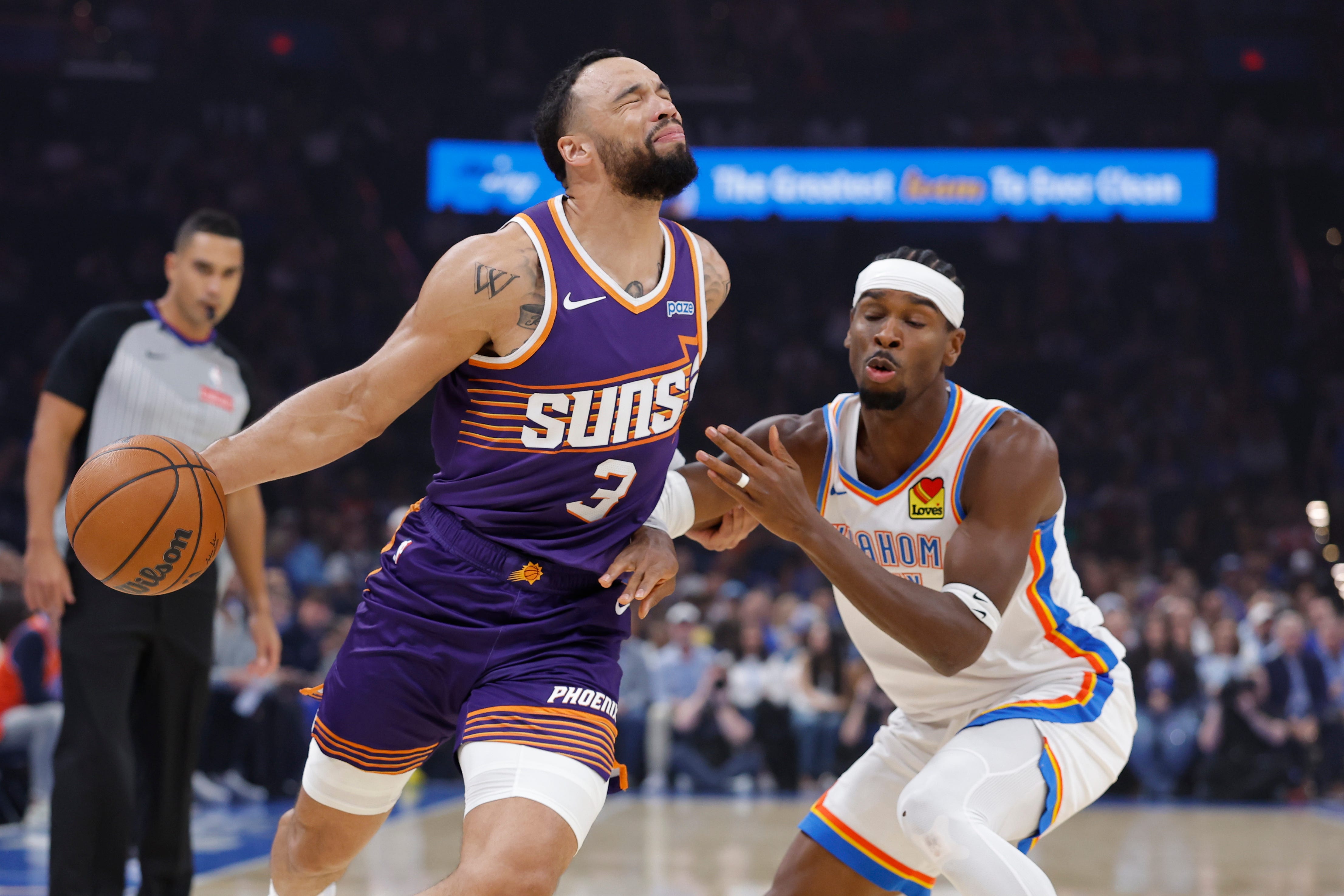 Oct 26, 2026; Oklahoma City, Oklahoma, USA;  Phoenix Suns forward Dillon Brooks (3) drives to the basket as Oklahoma City Thunder guard Shai Gilgeous-Alexander (2) defends during the first half at Paycom Center. Mandatory Credit: Alonzo Adams-Imagn Images