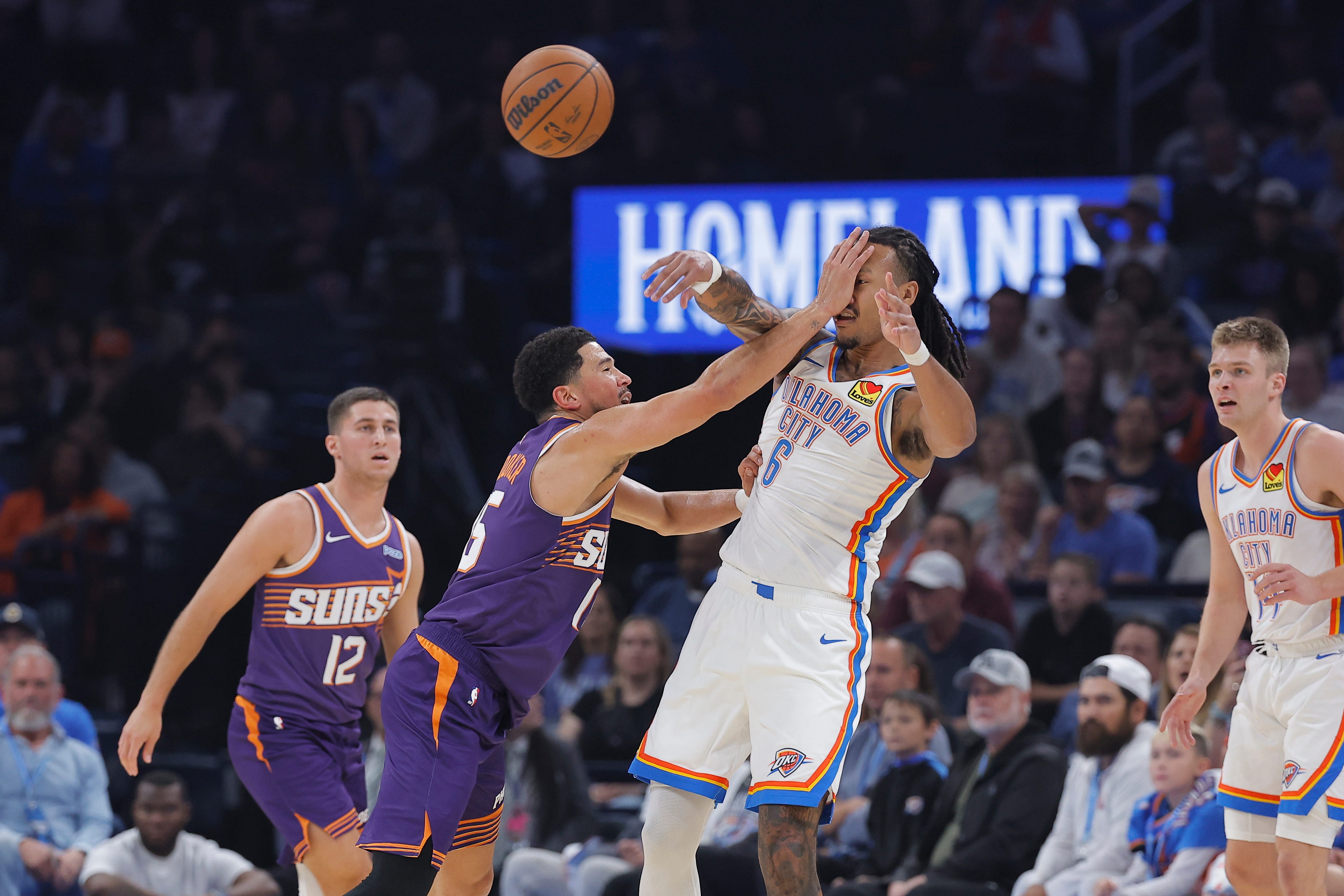 Oct 26, 2026; Oklahoma City, Oklahoma, USA; Phoenix Suns guard Devin Booker (15) defends a pass by Oklahoma City Thunder forward Jaylin Williams (6) during the first half at Paycom Center. Mandatory Credit: Alonzo Adams-Imagn Images
