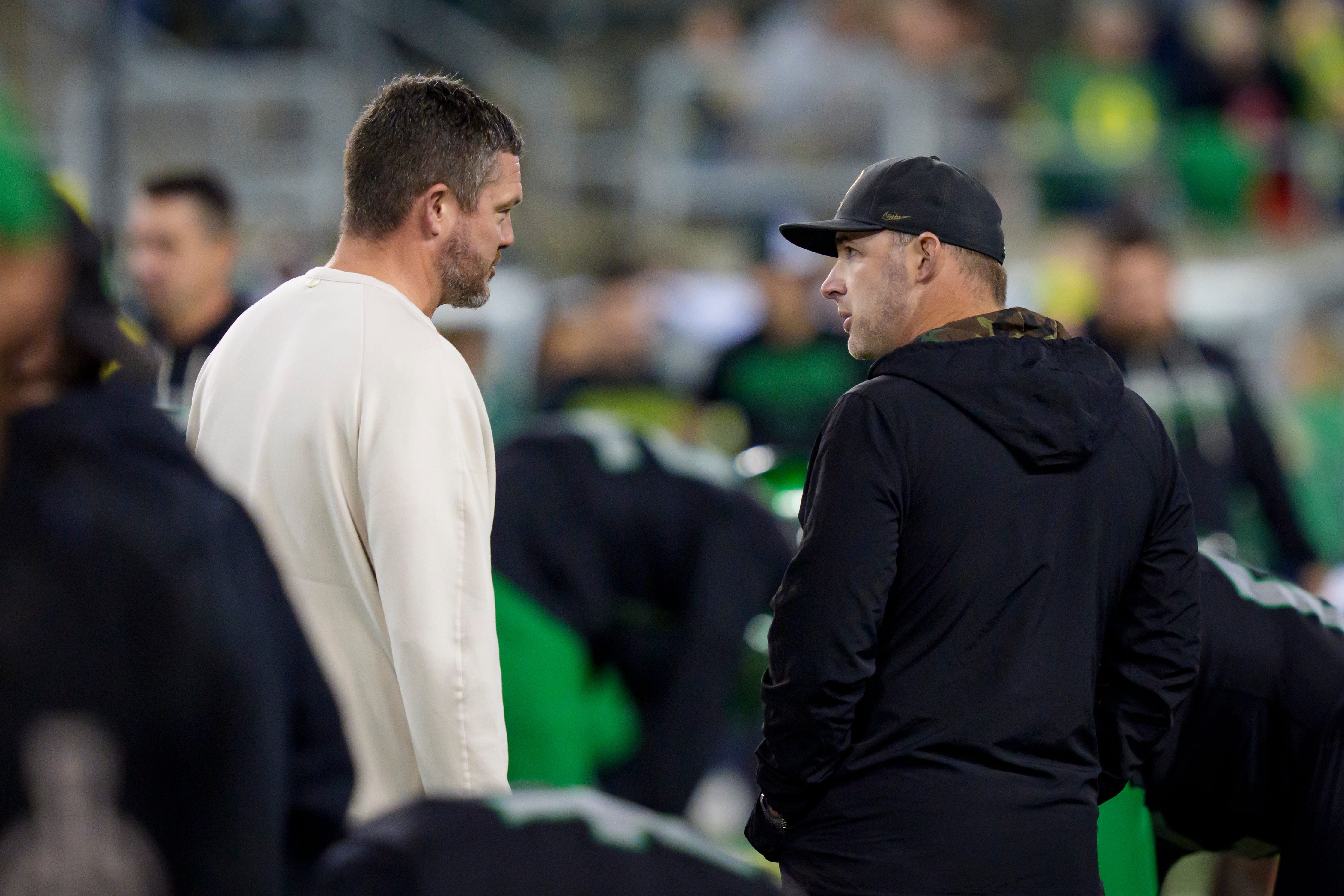 Oregon Ducks head coach Dan Lanning, left, talks to Oregon Ducks offensive coordinator Drew Mehringer before the game as the Oregon Ducks host the Nebraska Cornhuskers on Oct. 17, 2026, at Autzen Stadium in Eugene, Oregon.