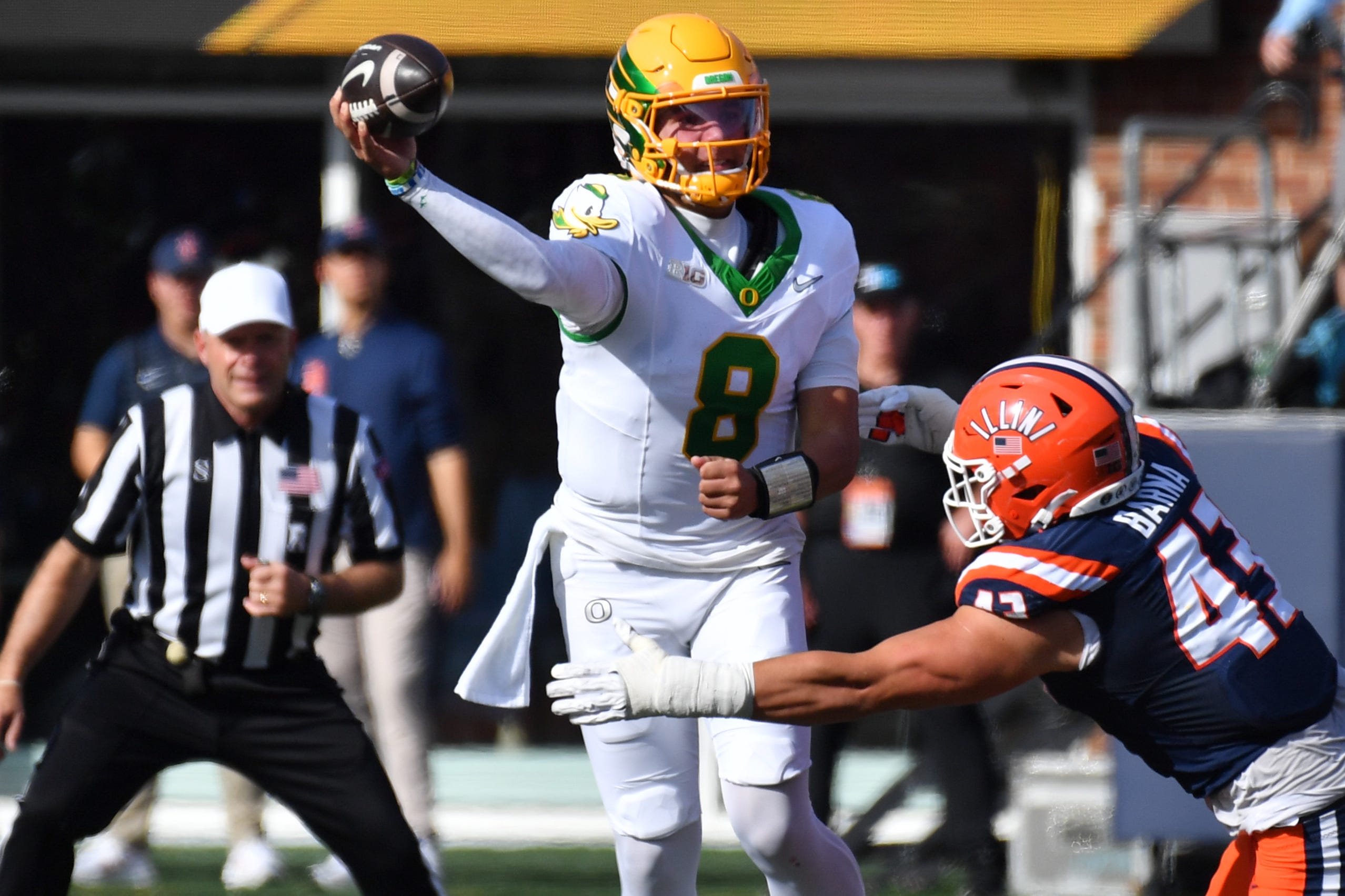 Illinois defensive lineman Joe Barna rushes Oregon quarterback Dylan Raiola during the first half at Gies Memorial Stadium in Champaign, Illinois on Oct. 24, 2026.