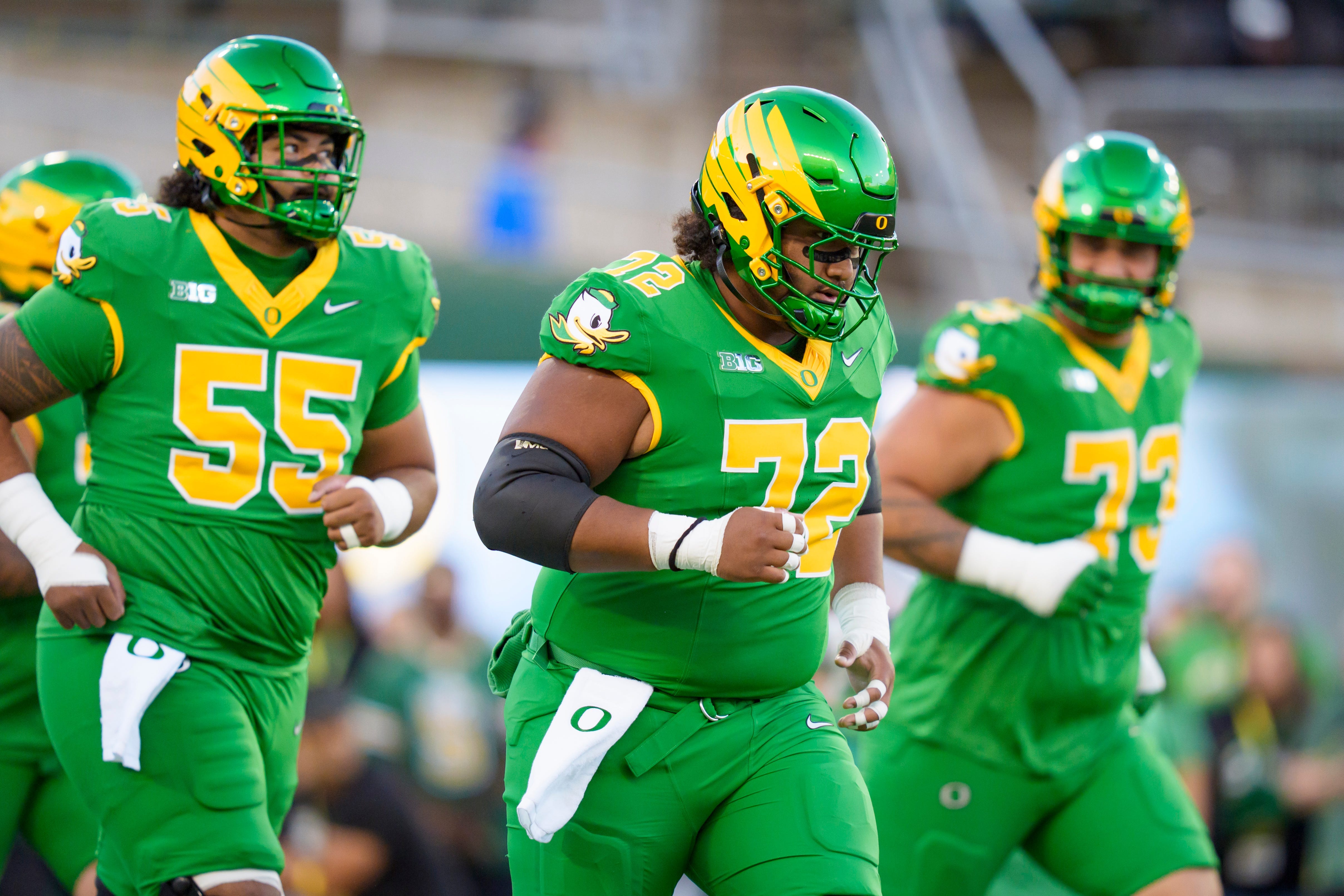 Oregon offensive lineman Iapani Laloulu, center, leads the offensive linemen onto the field as the Oregon Ducks host the Portland State Vikings on Sept. 18, 2026, at Autzen Stadium in Eugene, Oregon.