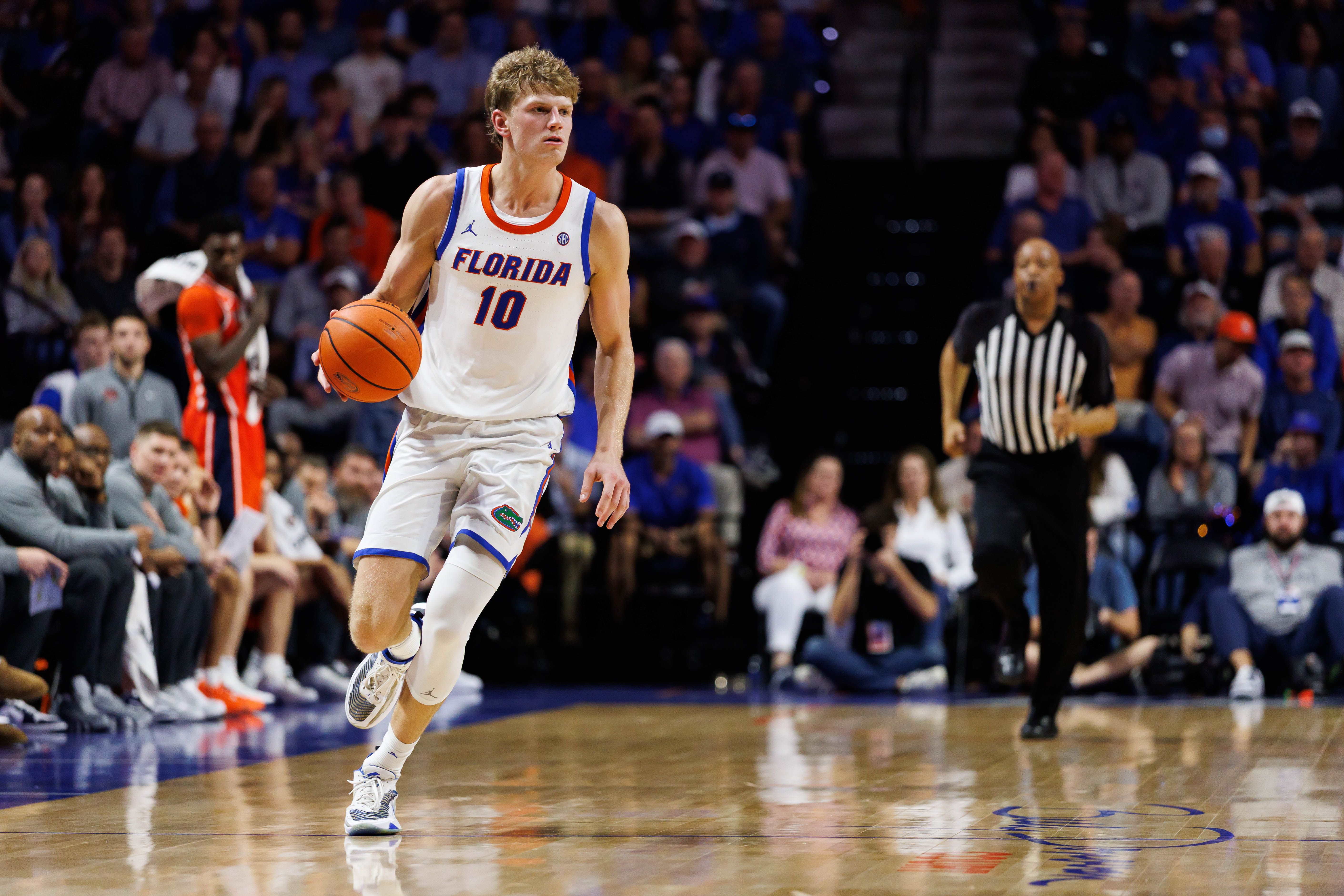 Jan 24, 2026; Gainesville, Florida, USA; Florida Gators forward Thomas Haugh (10) dribbles the ball against the Auburn Tigers during the second half at Exactech Arena at the Stephen C. O'Connell Center. Mandatory Credit: Matt Pendleton-Imagn Images