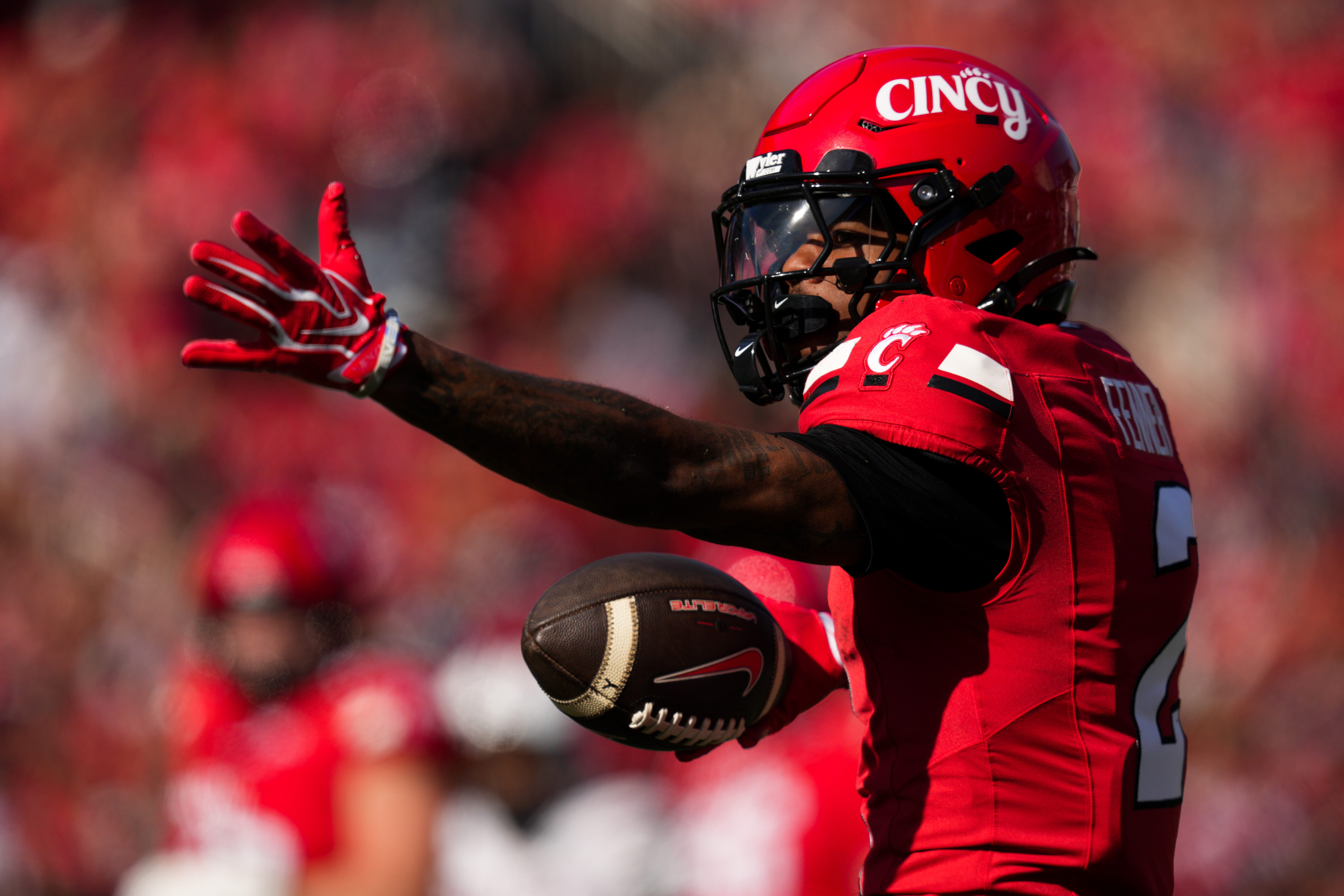 Oct 24, 2026; Cincinnati, Ohio, USA;  Cincinnati Bearcats wide receiver Larenzo Fenner (2) gestures a first down after making a catch against the Texas Tech Red Raiders in the second half at Nippert Stadium. Mandatory Credit: Aaron Doster-Imagn Images