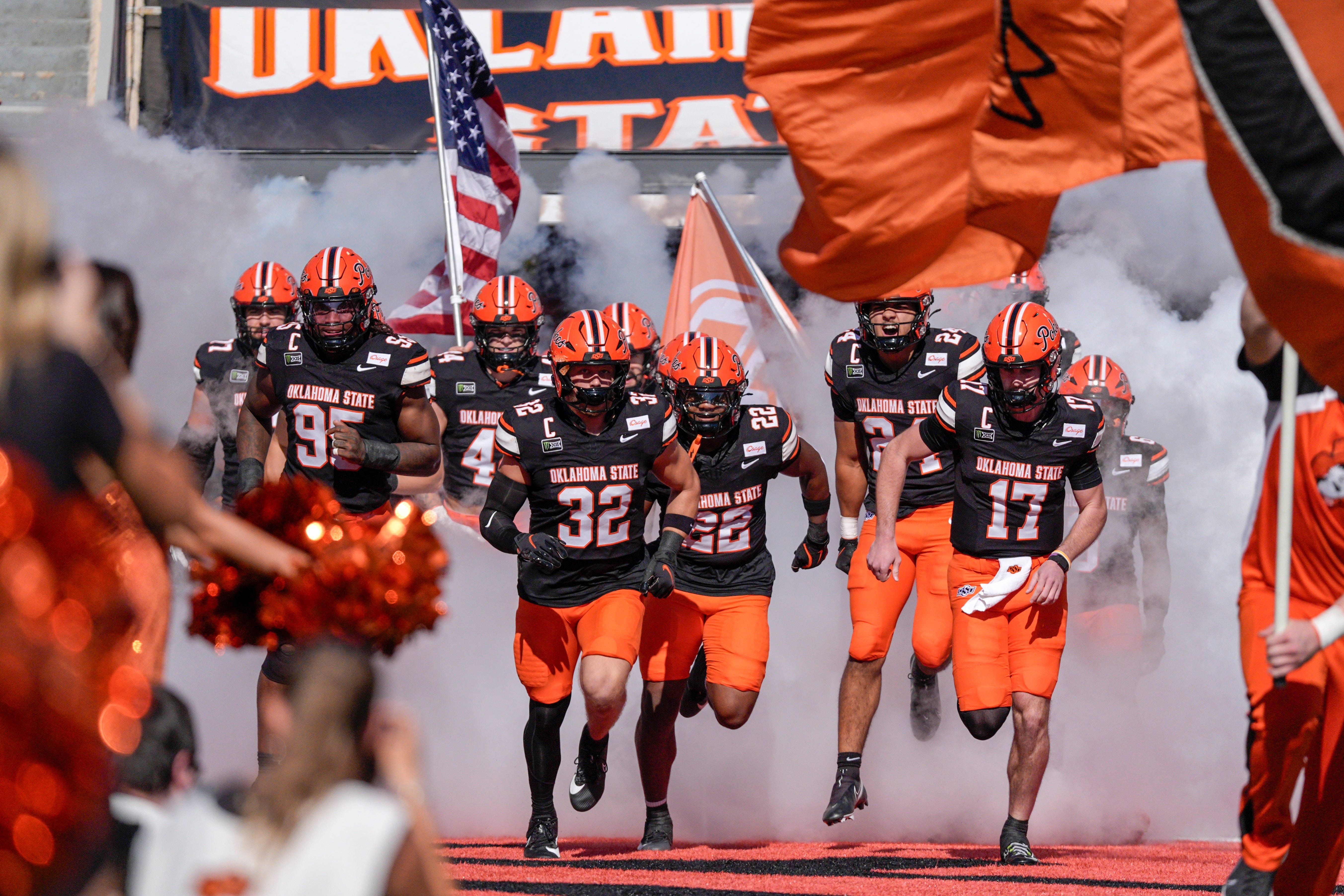 OSU players run on the field before an NCAA football game between the Oklahoma State University (OSU) Cowboys and the University of Central Florida (UCF) Knights at Boone Pickens Stadium in Stillwater, Okla., on Saturday, Oct. 10, 2026.