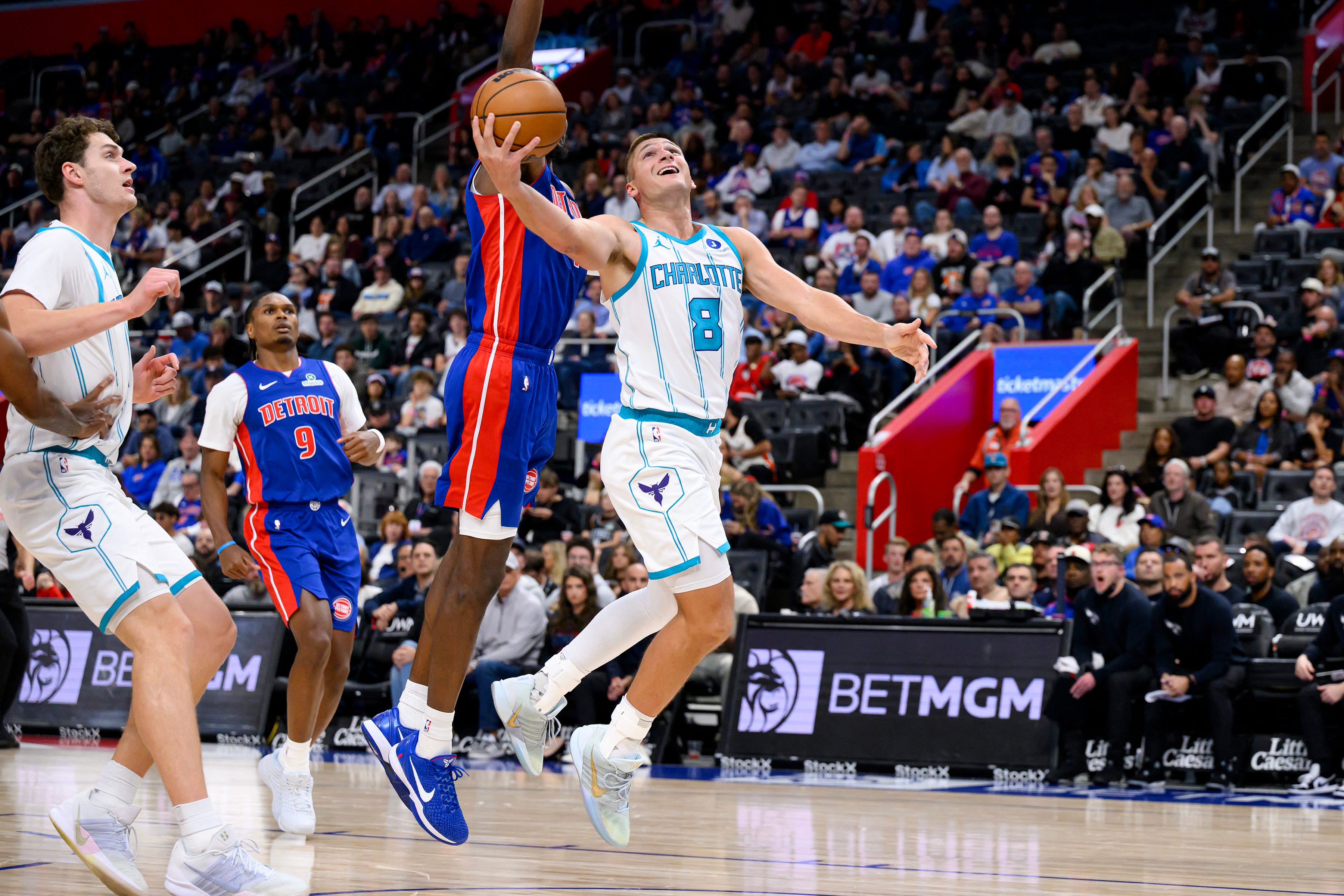 Oct 28, 2026; Detroit, Michigan, USA;  Charlotte Hornets guard Grayson Allen (8) drives to the basket against Detroit Pistons guard Javonte Green (31) in the first quarter at Little Caesars Arena.  Mandatory Credit: Lon Horwedel-Imagn Images