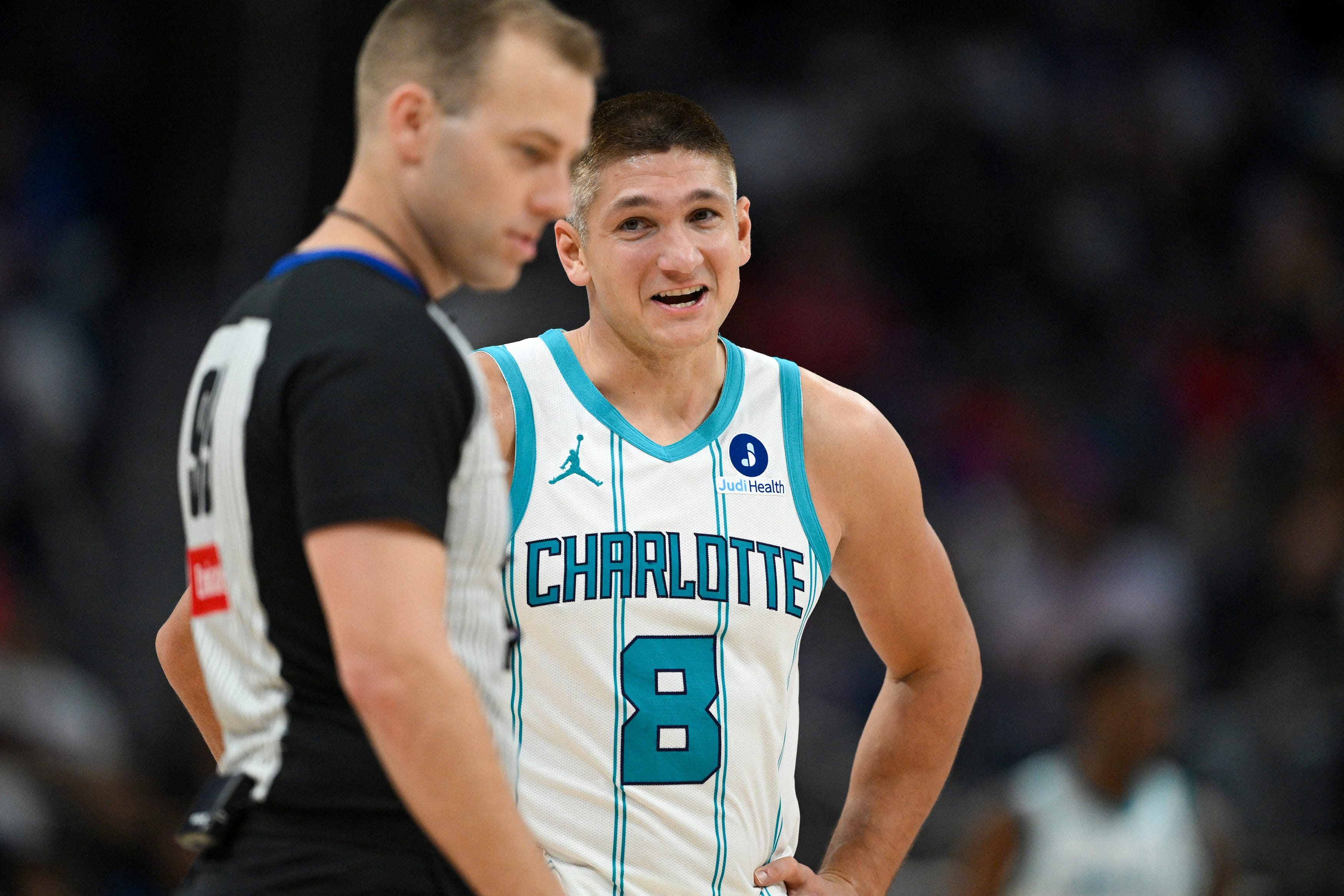 Oct 28, 2026; Detroit, Michigan, USA;  Charlotte Hornets guard Grayson Allen (8) talks to referee Tyler Ricks (95) after drawing a foul against the Detroit Pistons in the second quarter at Little Caesars Arena.  Mandatory Credit: Lon Horwedel-Imagn Images