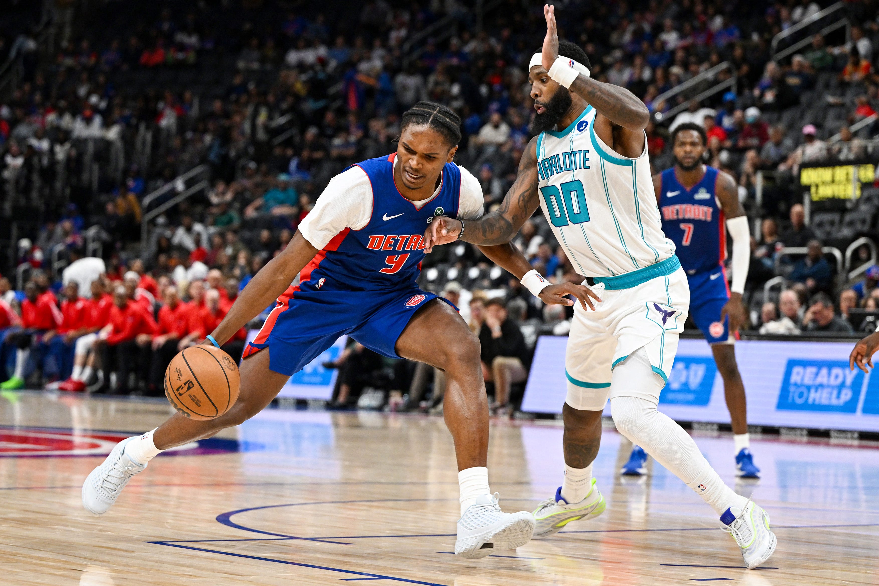 Oct 28, 2026; Detroit, Michigan, USA;  Detroit Pistons guard Ausar Thompson (9) tries to drive past Charlotte Hornets forward Royce O'Neale (00) in the second half at Little Caesars Arena.  Mandatory Credit: Lon Horwedel-Imagn Images