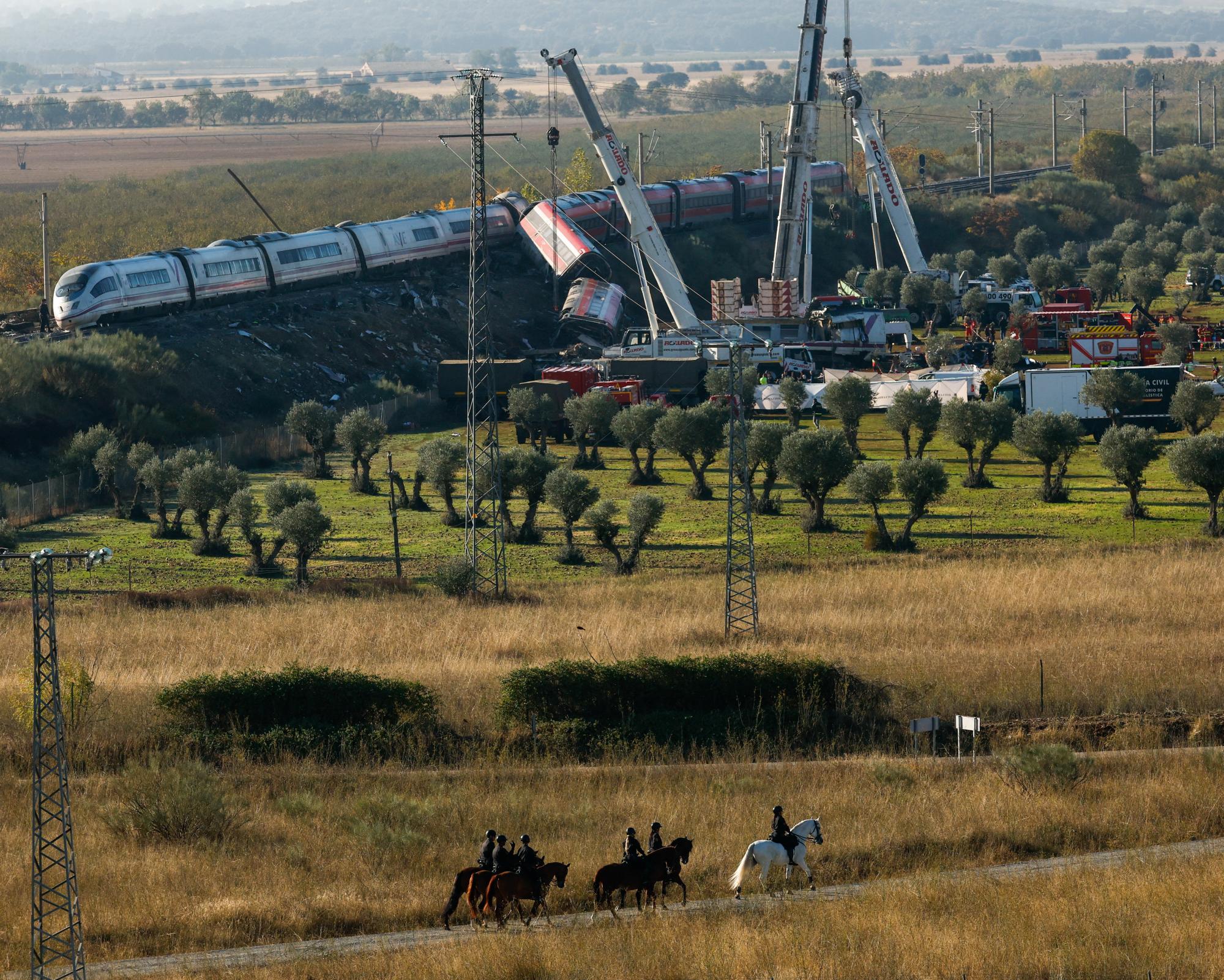 Spain begins mourning period after train crash as search continues for victims in wreckage